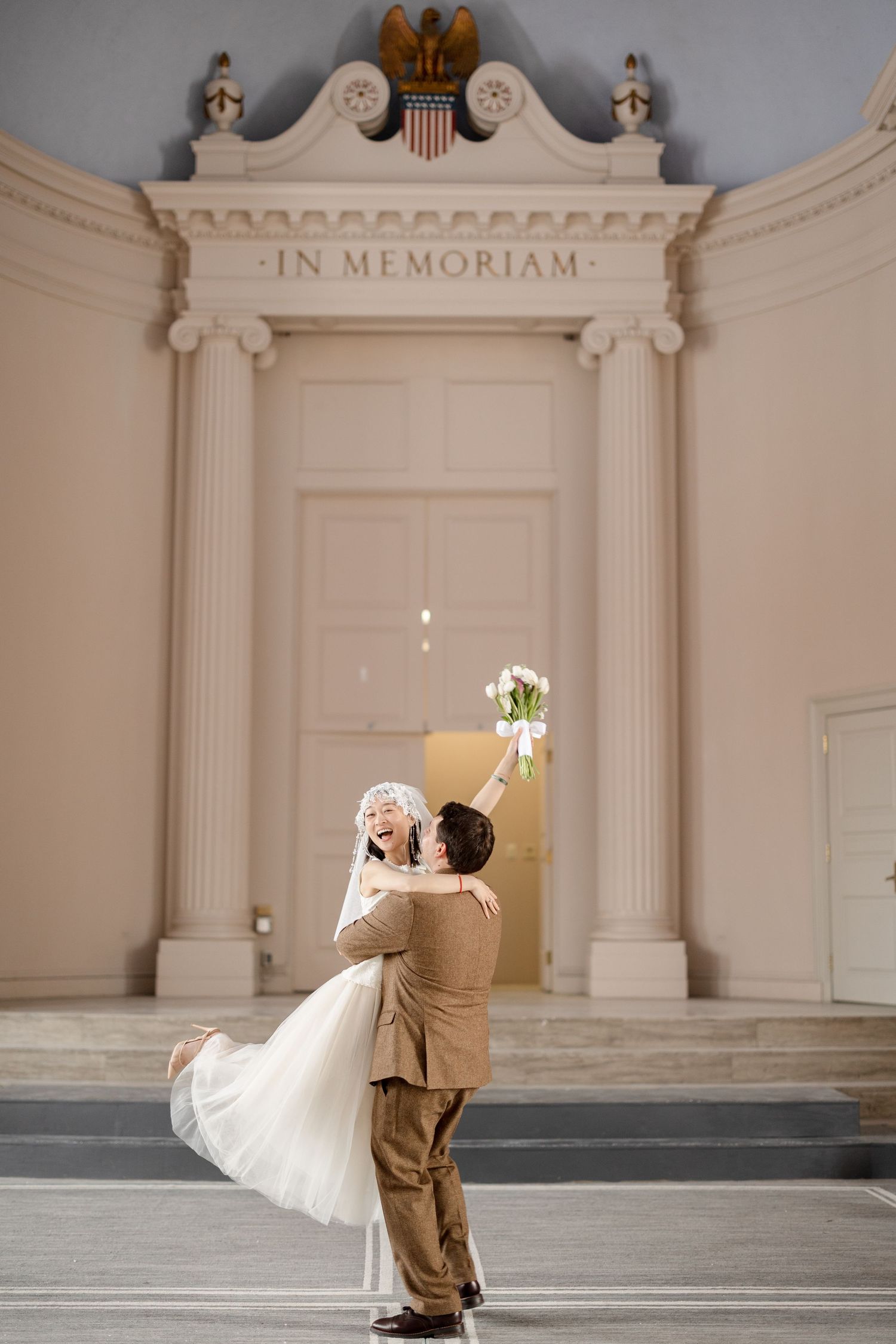 Groom and bride in elegant ceremony hall at Newton City Hall in Newton, Massachusetts, captured by Grand Photo by Karyna Oliinyk