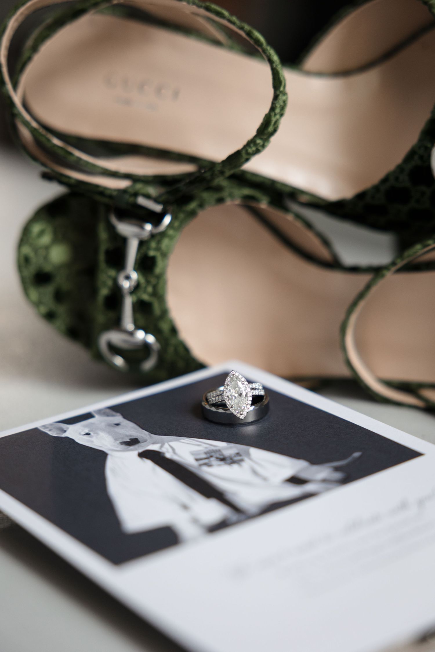 Wedding invitation and green Gucci heels at Le Méridien Tampa, Florida, captured by Grand Photo by Karyna Oliinyk