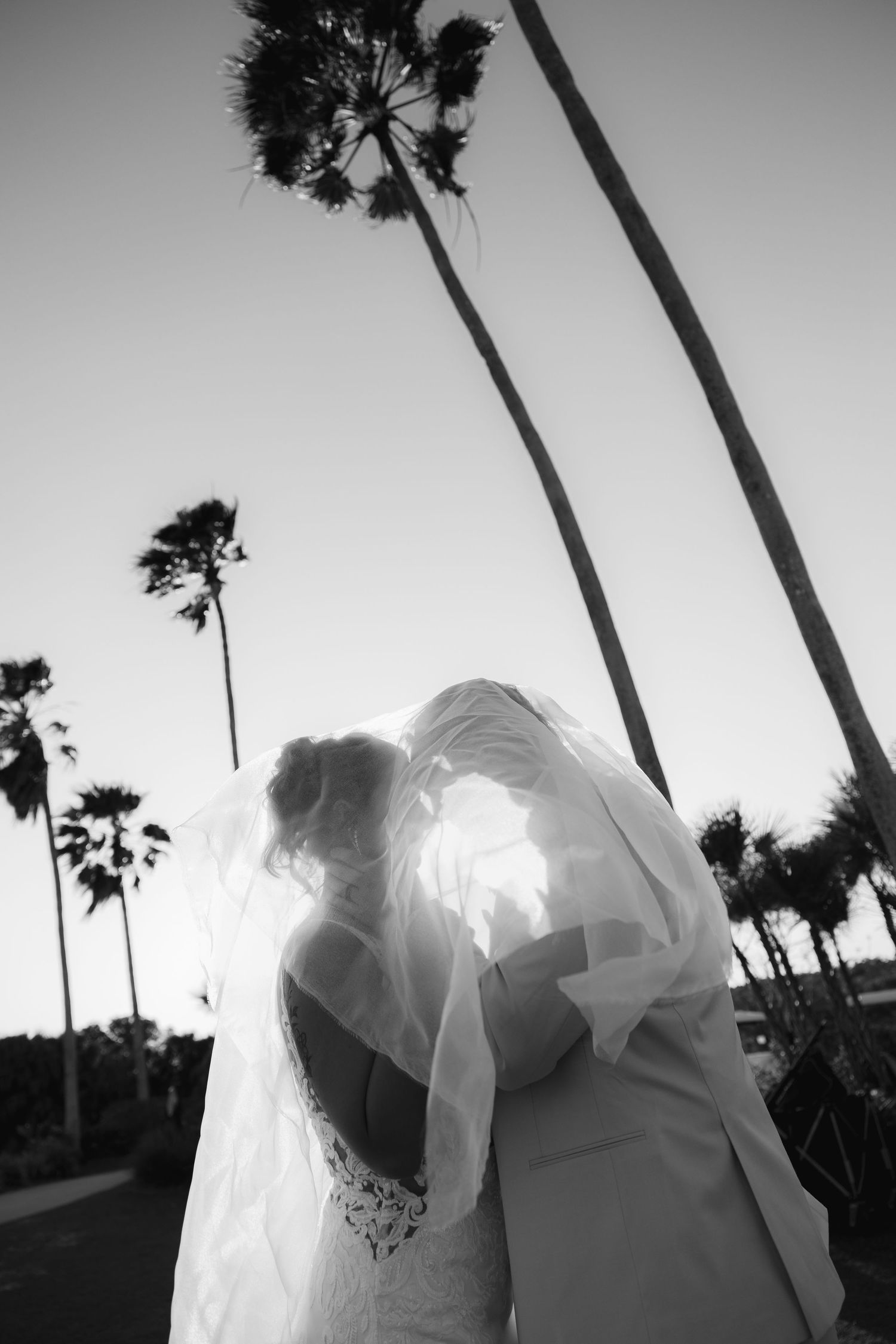 Bride and groom kiss under veil in St. Petersburg, captured by Grand Photo by Karyna Oliinyk