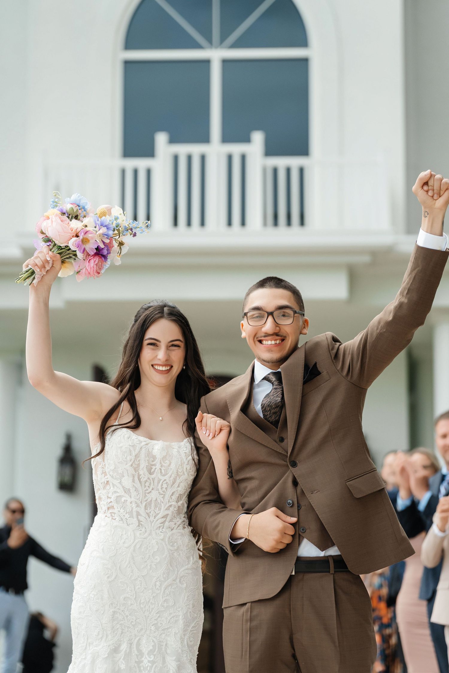 Newlyweds exiting after the ceremony at Harborside Chapel in Safety Harbor, Florida — wedding photographer Grand Photo, Karyna Oliinyk