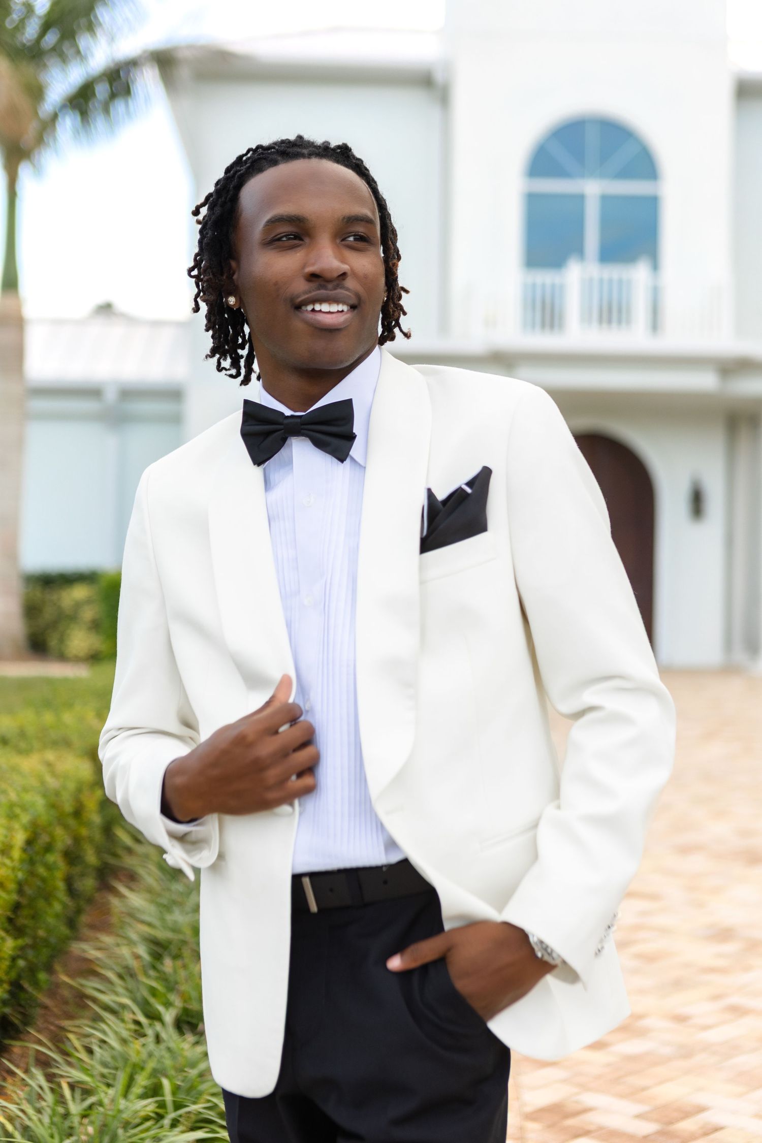 Black groom portrait at Harborside Chapel in Safety Harbor, Florida — wedding photographer Grand Photo, Karyna Oliinyk