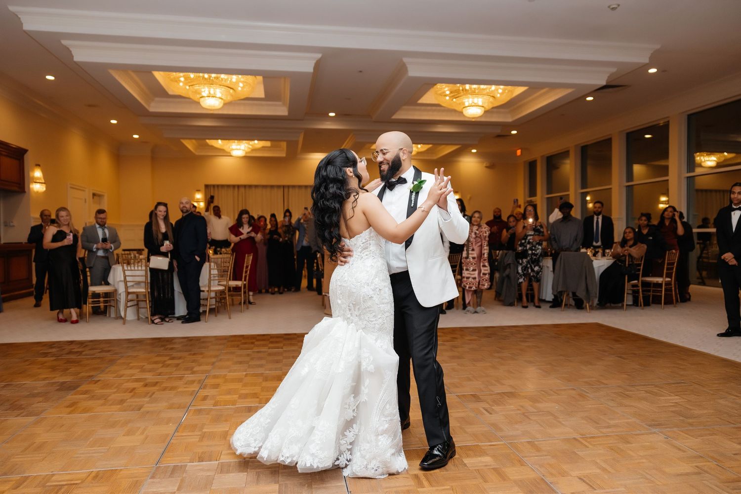 Bride and groom’s first dance during reception at The Ritz-Carlton Sarasota in Sarasota, Florida — wedding photographer Grand Photo
