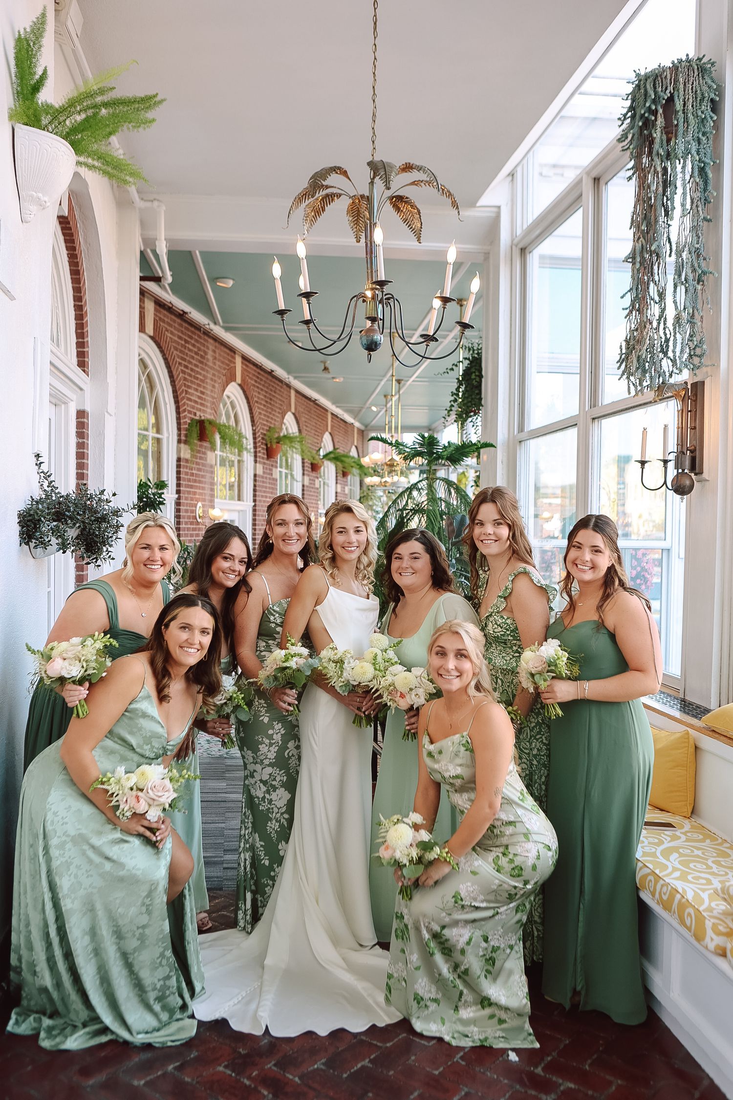 Bride with bridesmaids in sage green gowns at Powel Crosley Estate in Sarasota, Florida, captured by Grand Photo by Karyna Oliinyk