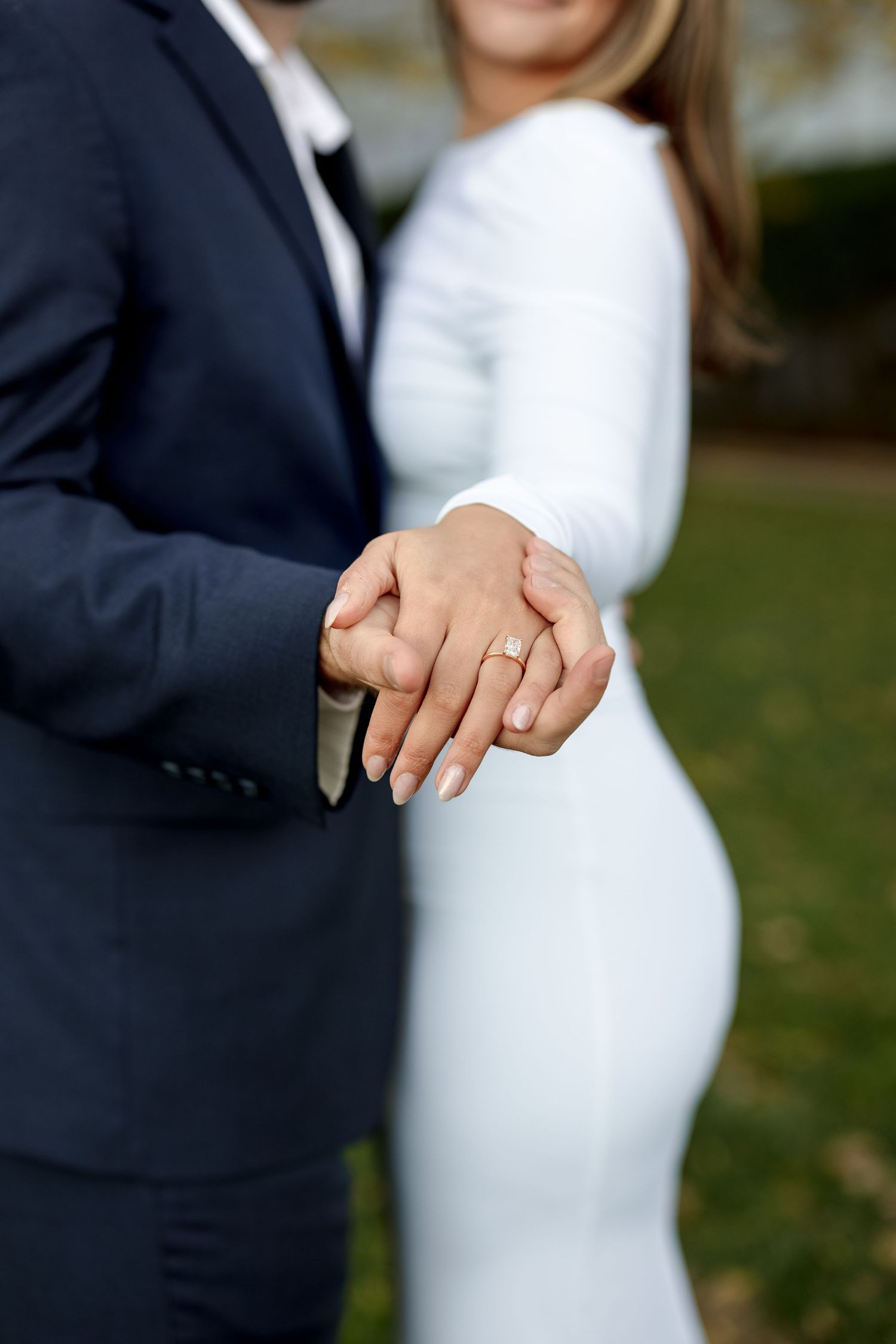 Newlyweds hold hands showing wedding rings at Boston Public Library Boston MA, wedding photographer Grand Photo Karyna Oliinyk
