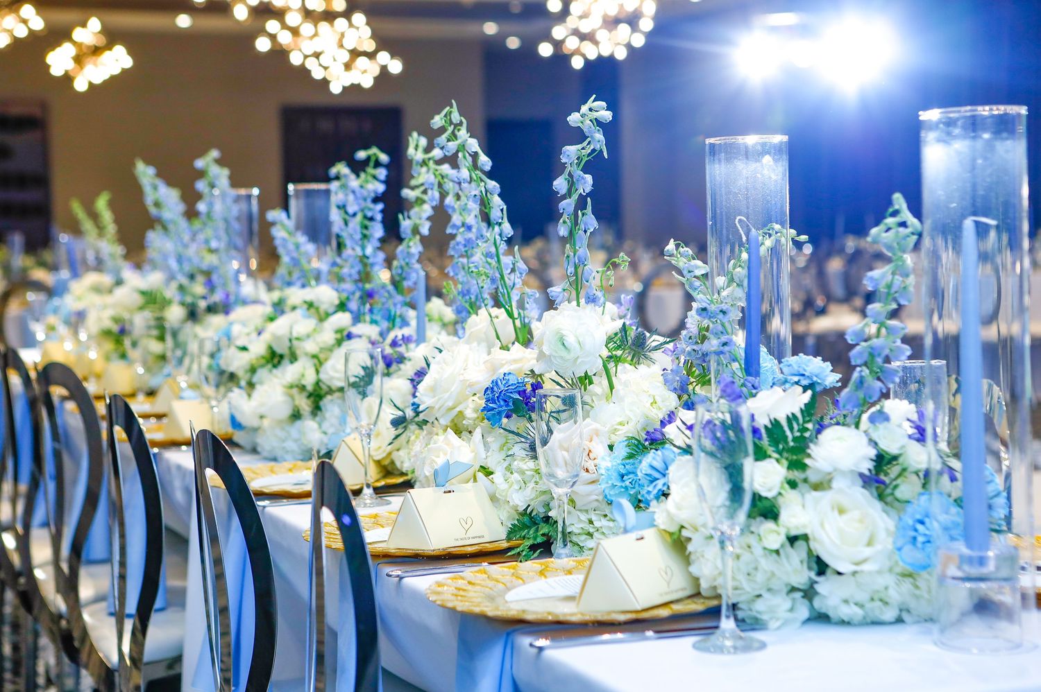 Luxurious wedding banquet table with white and blue floral at The Tampa EDITION in Tampa, Florida, captured by Grand Photo by Karyna Oliinyk