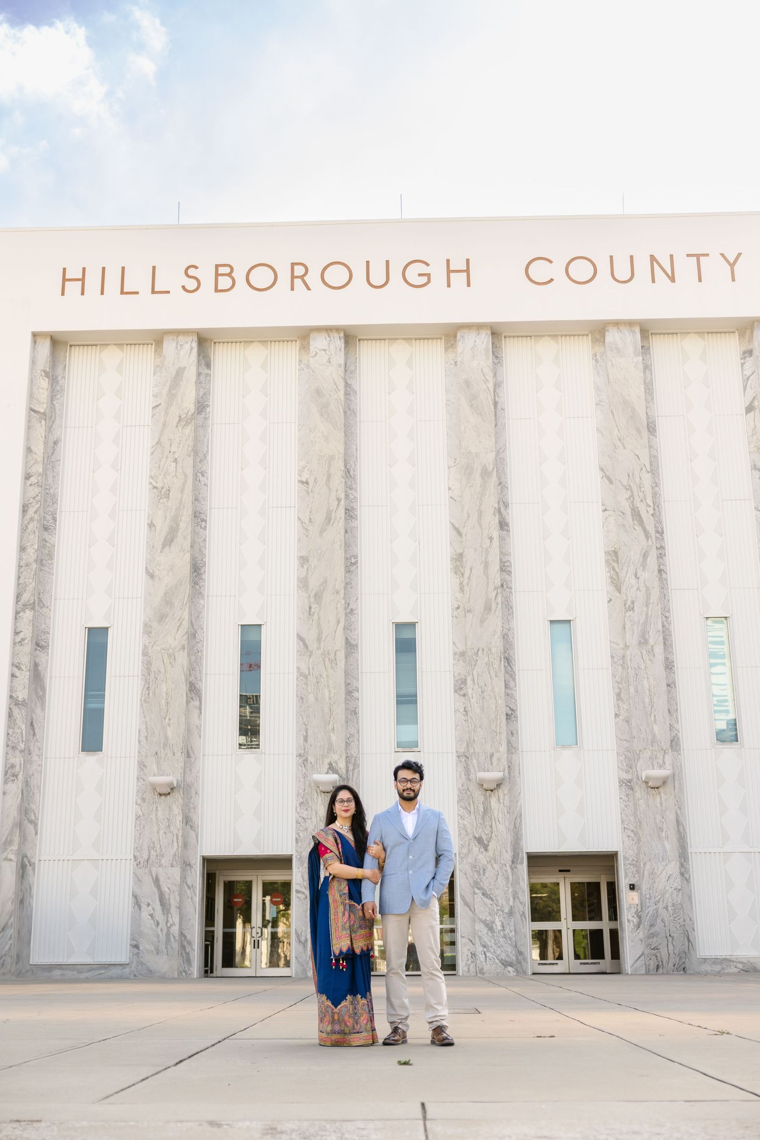 Wedding couple in Indian attire posing in front of Hillsborough County Courthouse Tampa, Florida, captured by Grand Photo by Karyna Oliinyk
