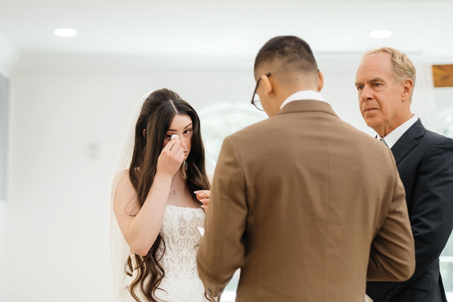 Bride crying during vow exchange at Harborside Chapel in Safety Harbor, Florida — wedding photographer Grand Photo, Karyna Oliinyk