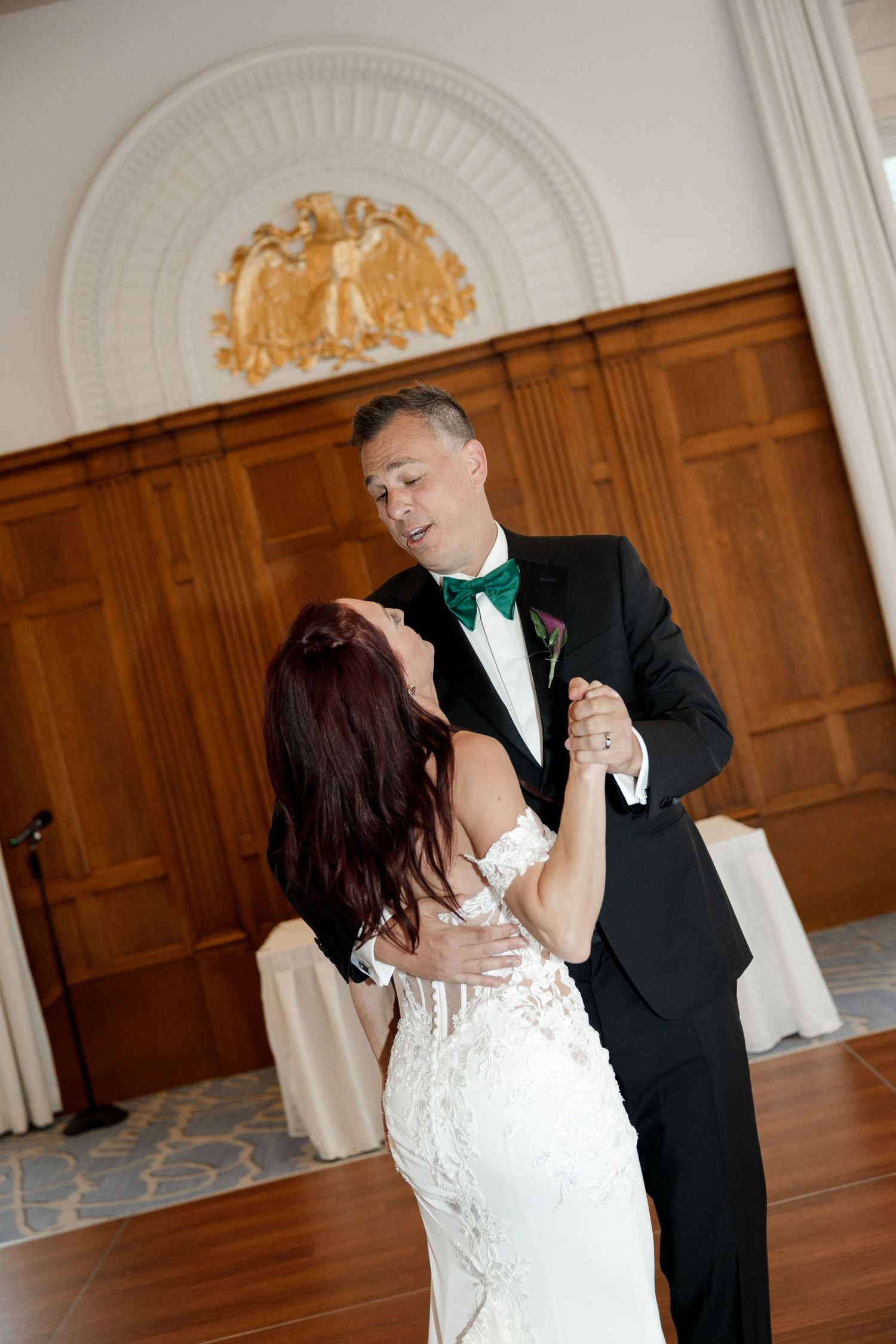 Bride and groom share their first dance in an elegant ballroom at Le Méridien Tampa, Florida, captured by Grand Photo by Karyna Oliinyk