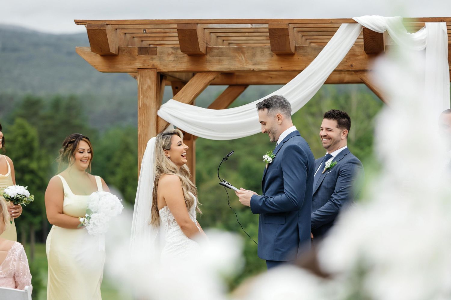 Outdoor wedding ceremony at Owl’s Nest Resort NH —  wedding photographer Grand Photo
