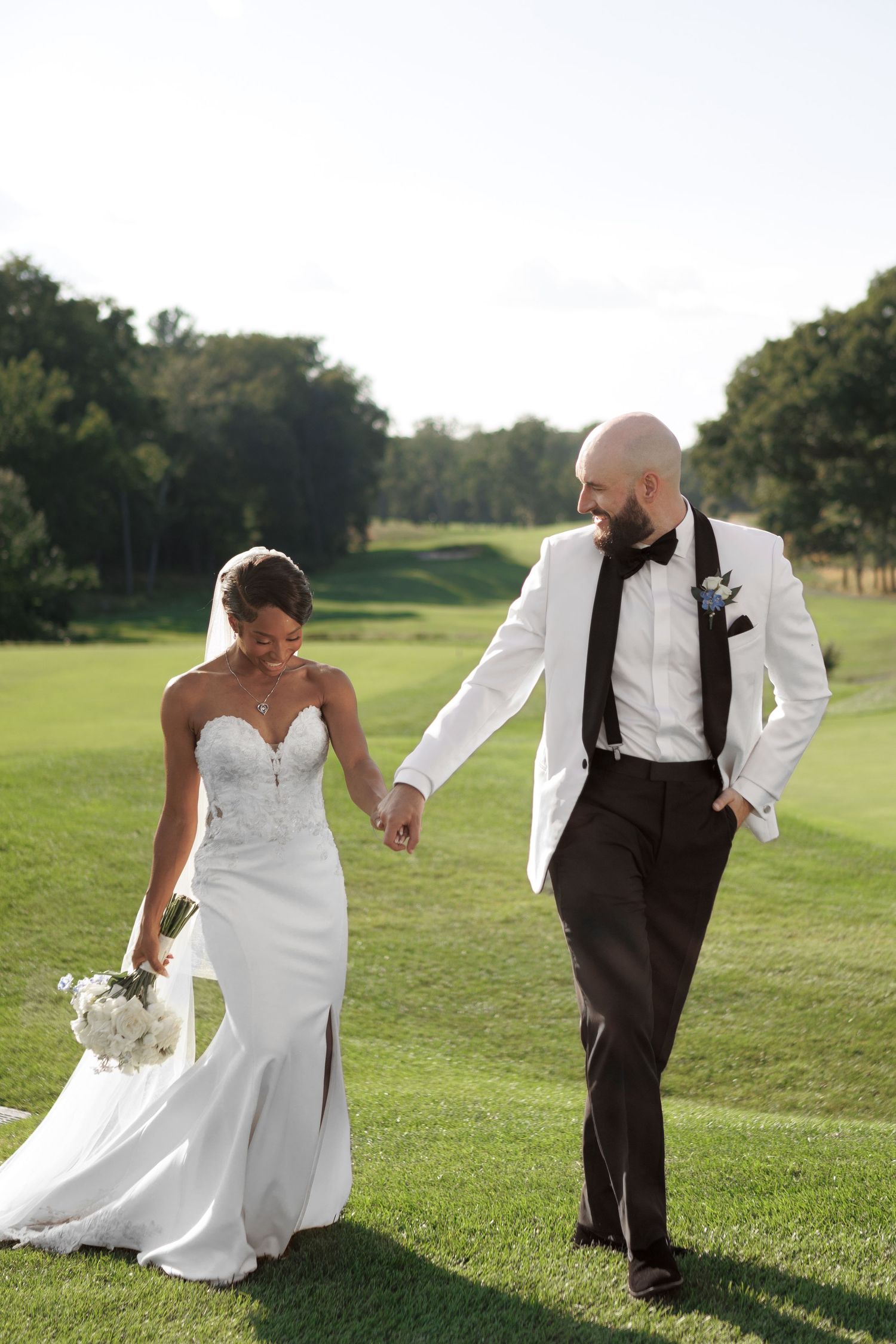 Bride and groom walking hand in hand at Mill Pond Estate — Tampa Bay FL wedding photographer Grand Photo Karyna Oliinyk