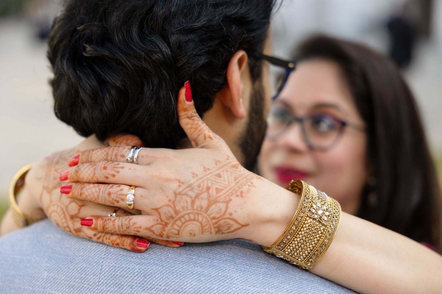 Bride embracing a groom during an Indian ceremony at Hillsborough County Courthouse Tampa, Florida, captured by Grand Photo by Karyna