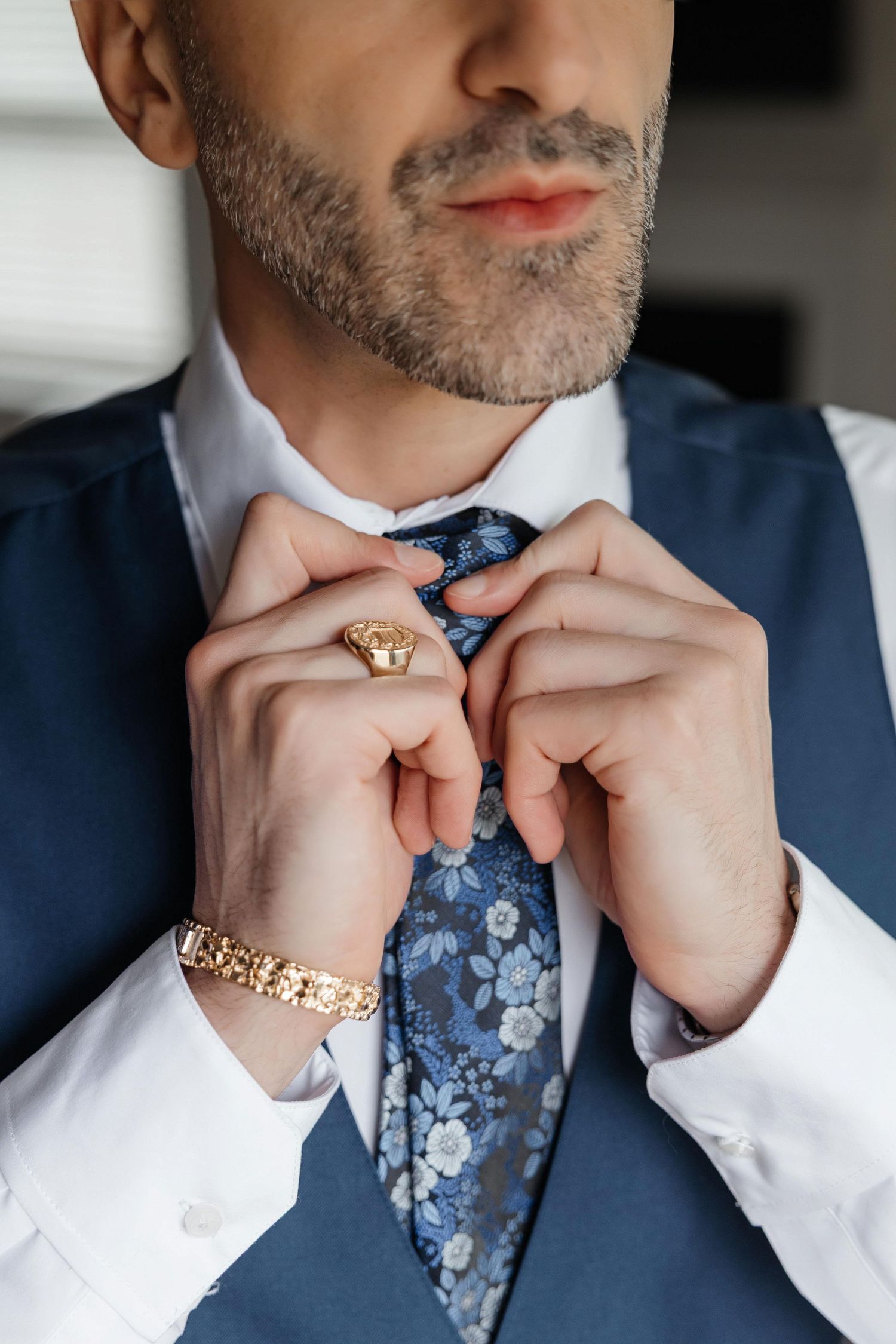 Groom getting ready at Owls Nest Resort in Thornton, New Hampshire, captured by Grand Photo by Karyna Oliinyk