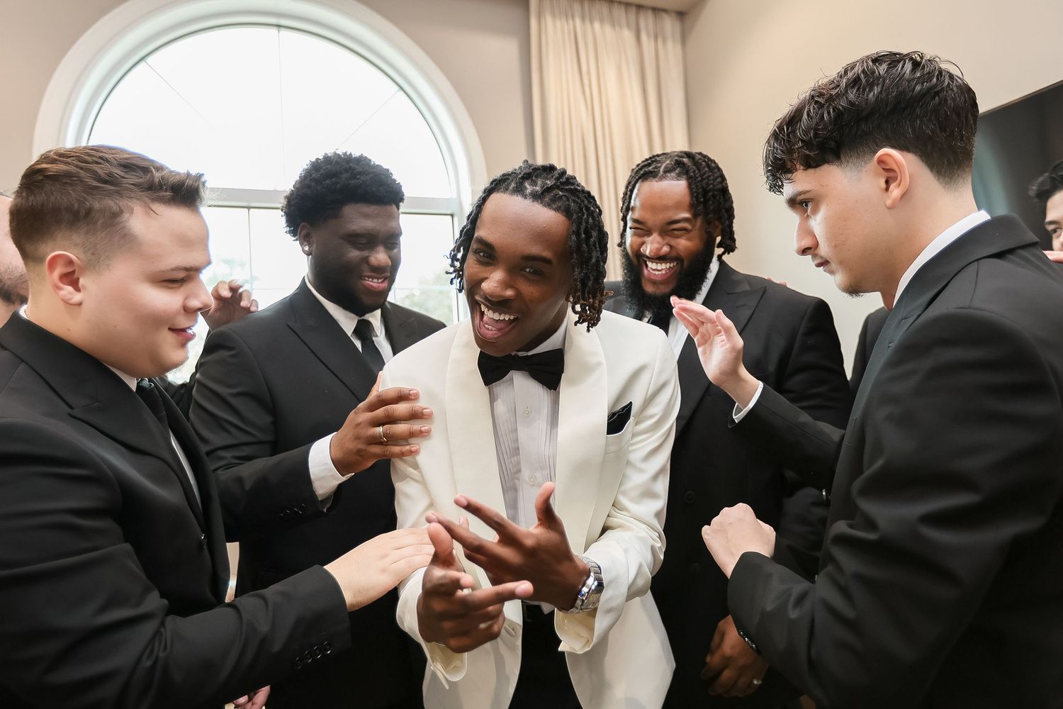 Groom with groomsmen getting ready at Harborside Chapel Safety Harbor FL, wedding photographer Grand Photo Karyna Oliinyk
