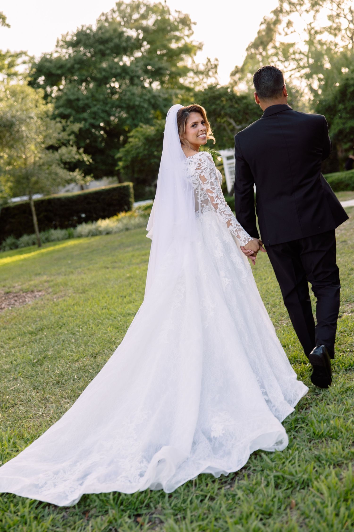 Bride and groom portraits at Tampa Garden Club, Florida, captured by Grand Photo by Karyna Oliinyk