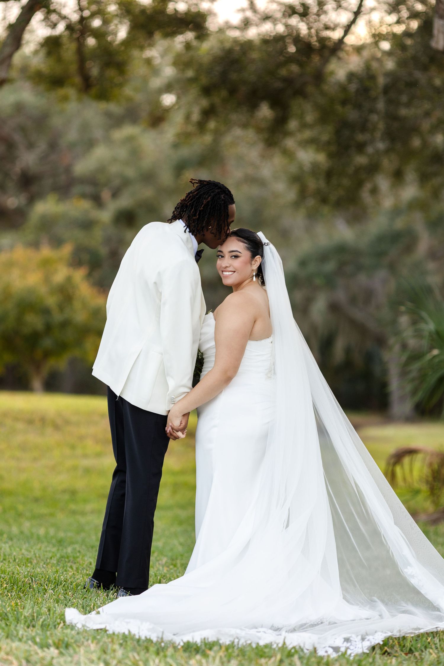 International bride and groom portraits at Harborside Chapel in Safety Harbor, Florida — wedding photographer Grand Photo, Karyna Oliinyk