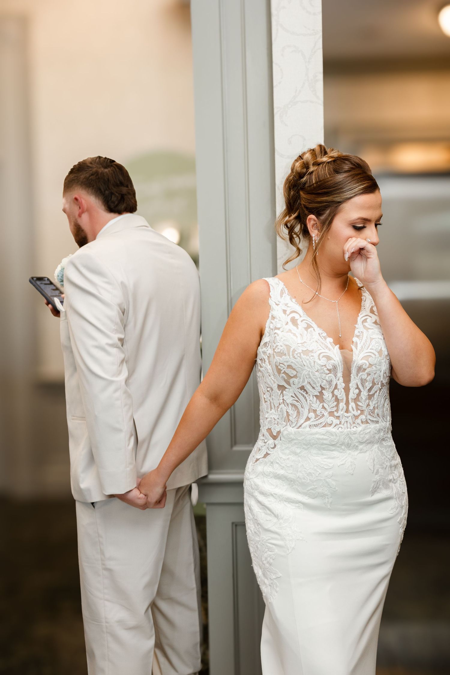 Emotional bride in tears during first touch at The Tampa Club in Tampa, Florida, captured by Grand Photo by Karyna Oliinyk