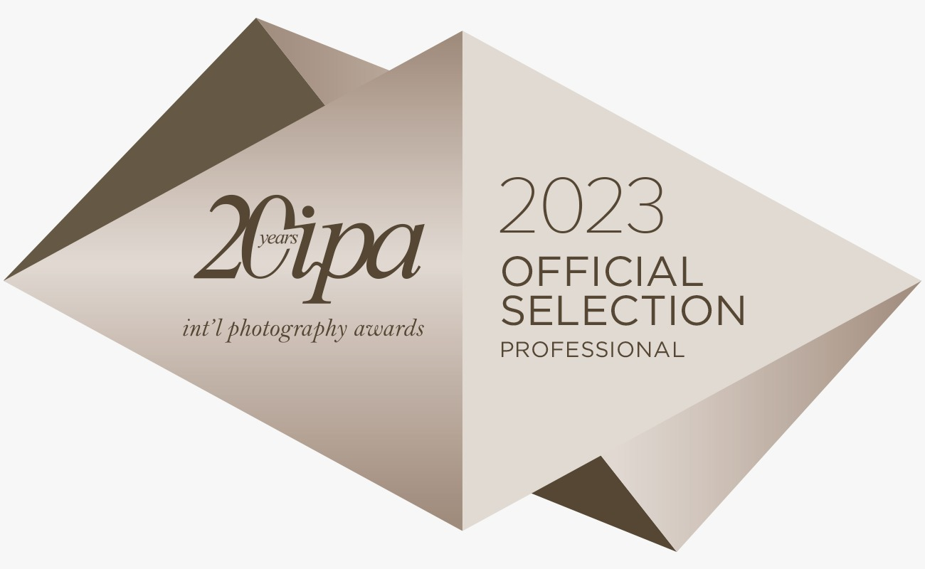 IPA 2023 Official Selection Professional photography award badge in gold geometric diamond design.