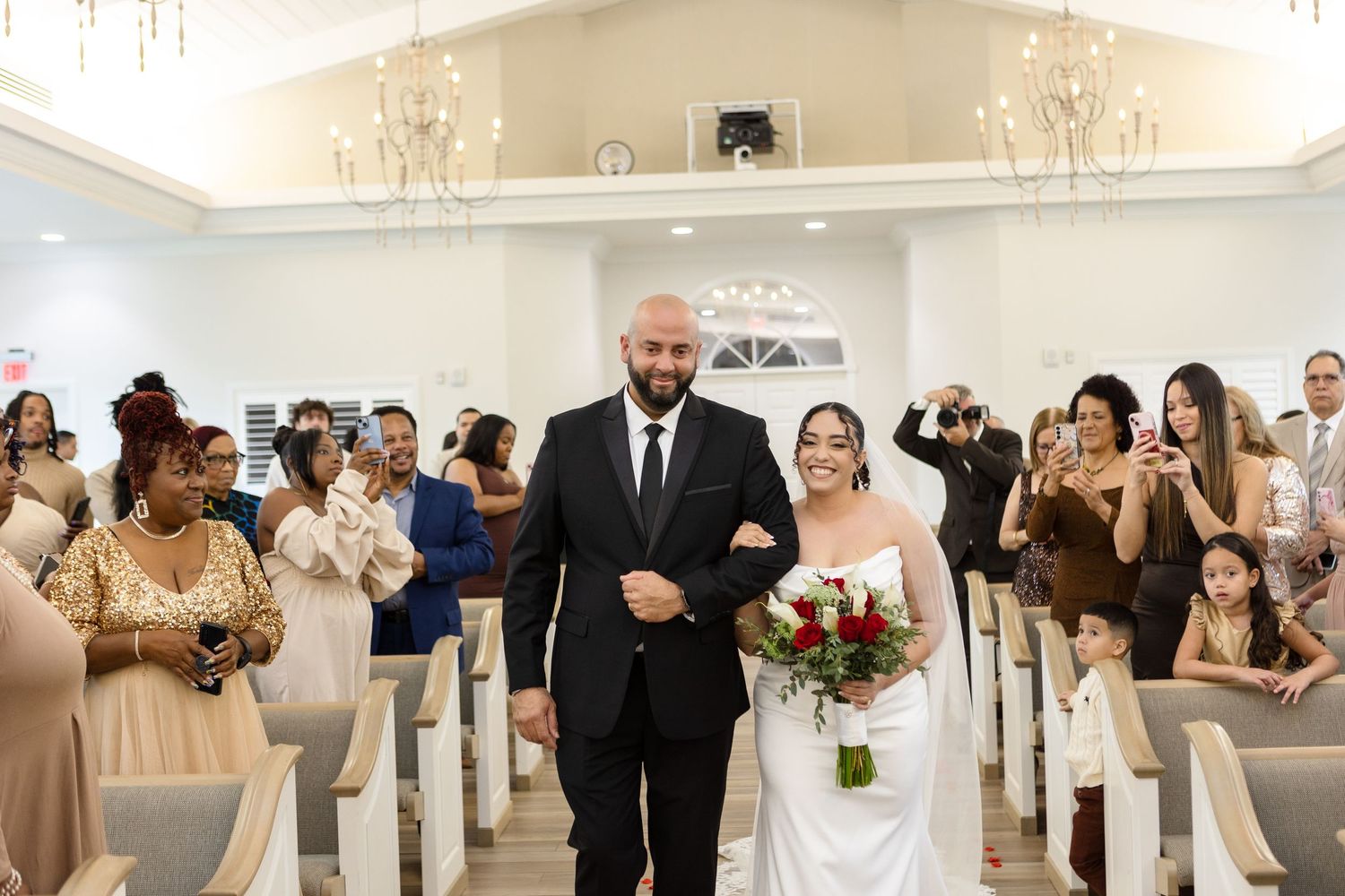 Bride and her dad walking down the aisle at Harborside Chapel in Safety Harbor, Florida — wedding photographer Grand Photo, Karyna Oliinyk