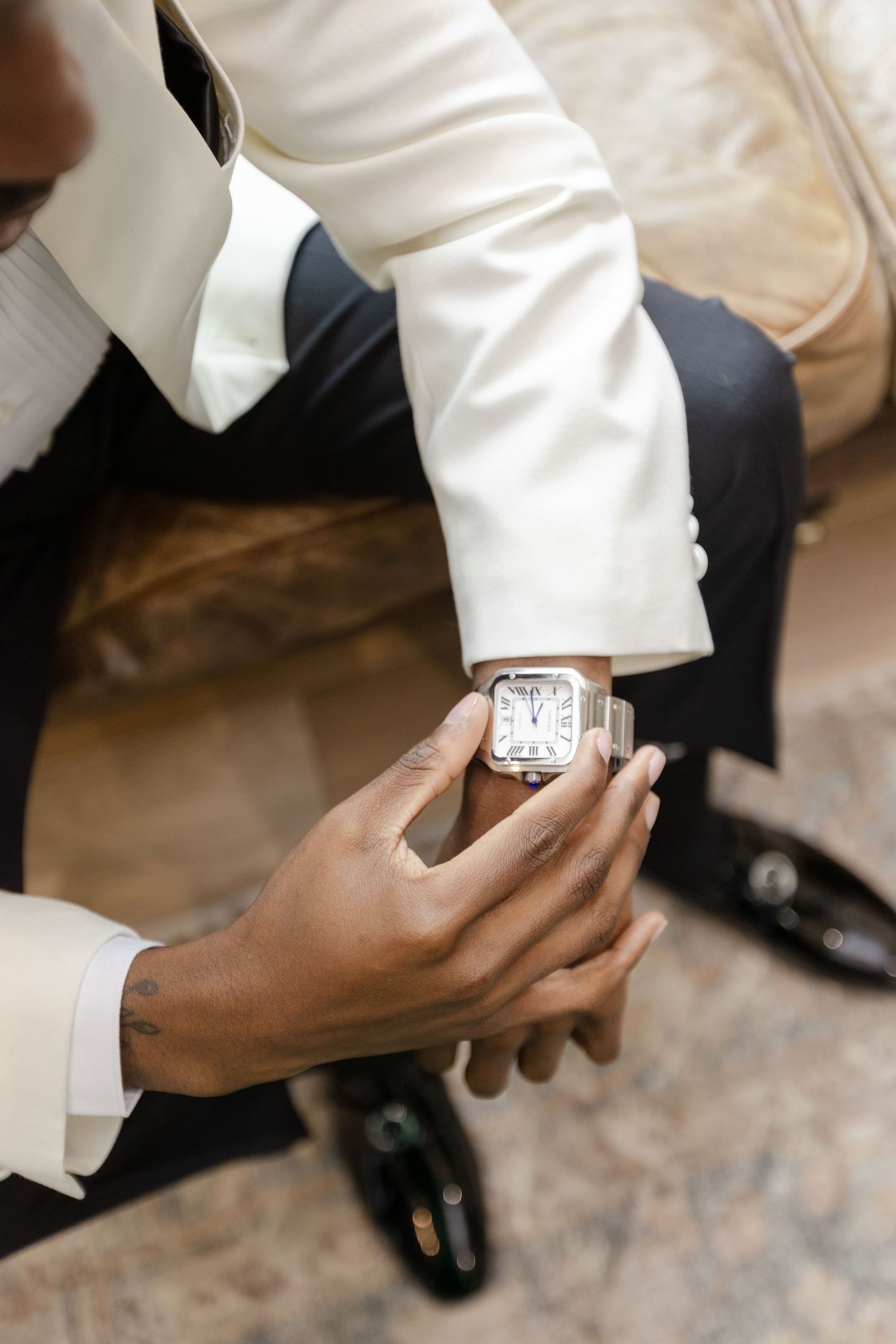 Groom wearing a luxury Cartier watch before the ceremony at Harborside Chapel in Safety Harbor, Florida — wedding photographer Grand Photo