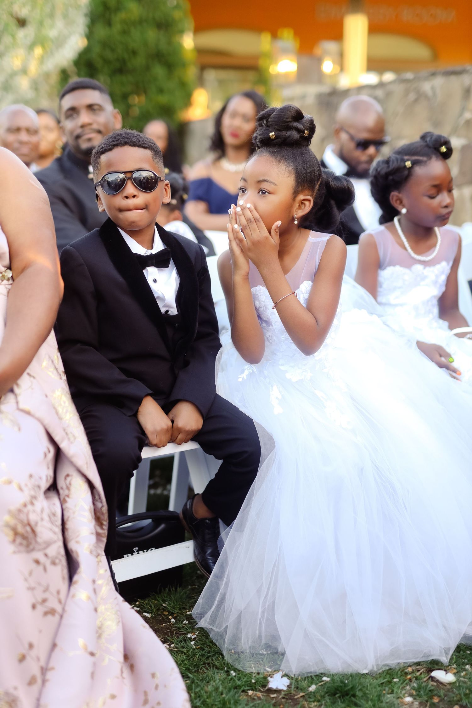 Ring bearer and flower girl during outdoor ceremony at Danversport in Danvers, Massachusetts, captured by Grand Photo by Karyna Oliinyk