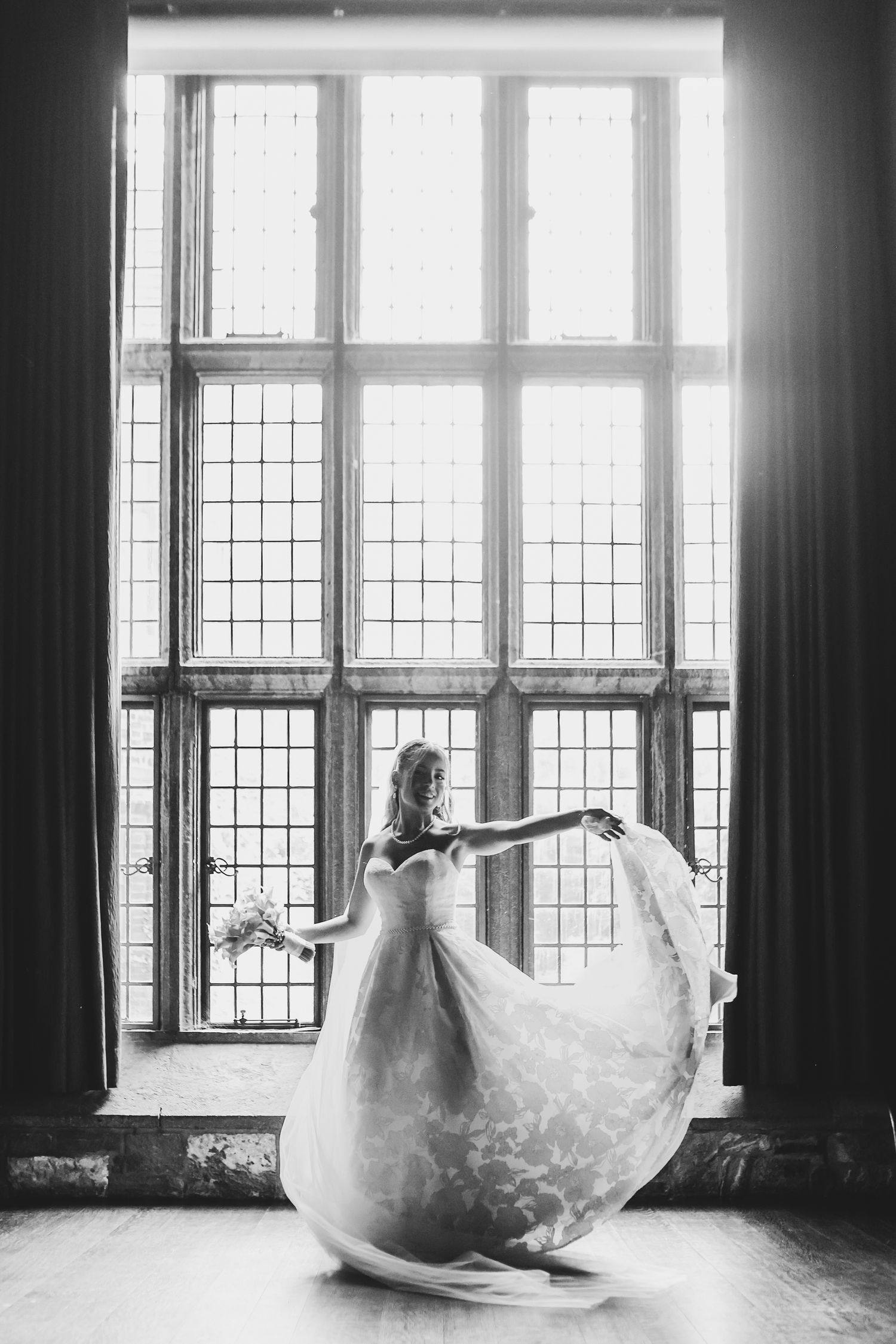 Bride twirls elegantly at Ca' d'Zan Mansion in Sarasota, Florida, captured by Grand Photo by Karyna Oliinyk.