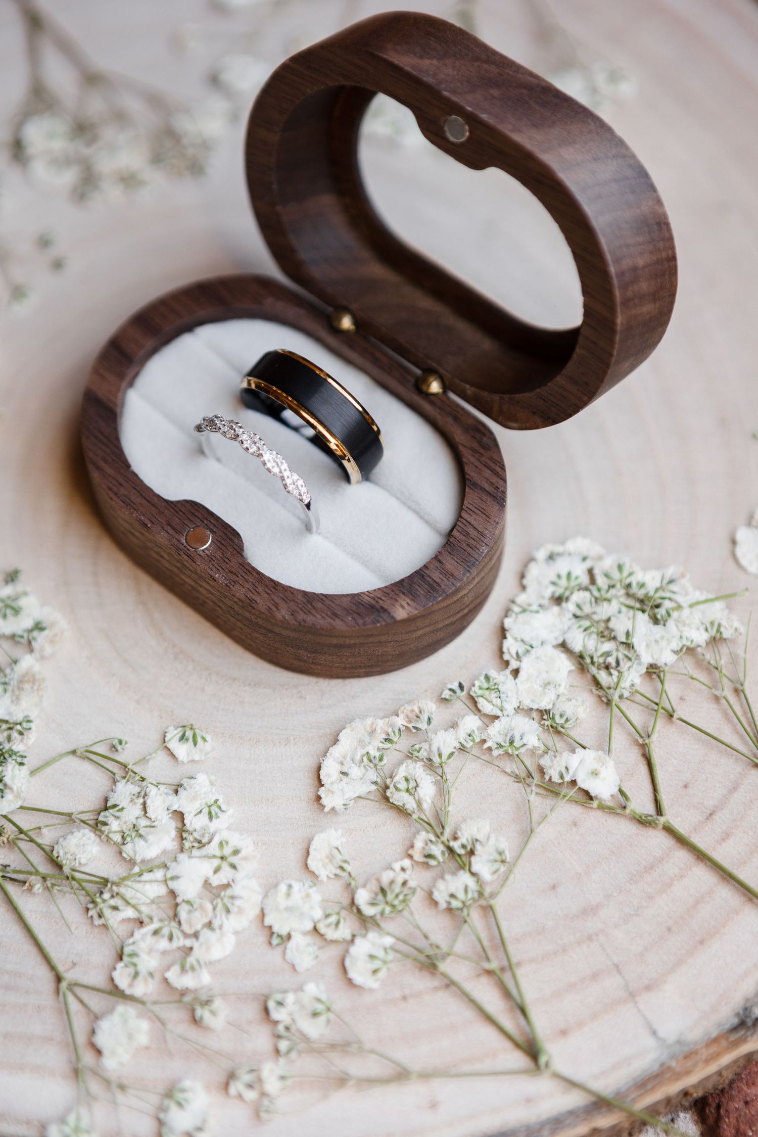 Flatlay wedding bands in wooden box at JW Marriott Water Street Tampa FL, wedding photographer Grand Photo Karyna Oliinyk