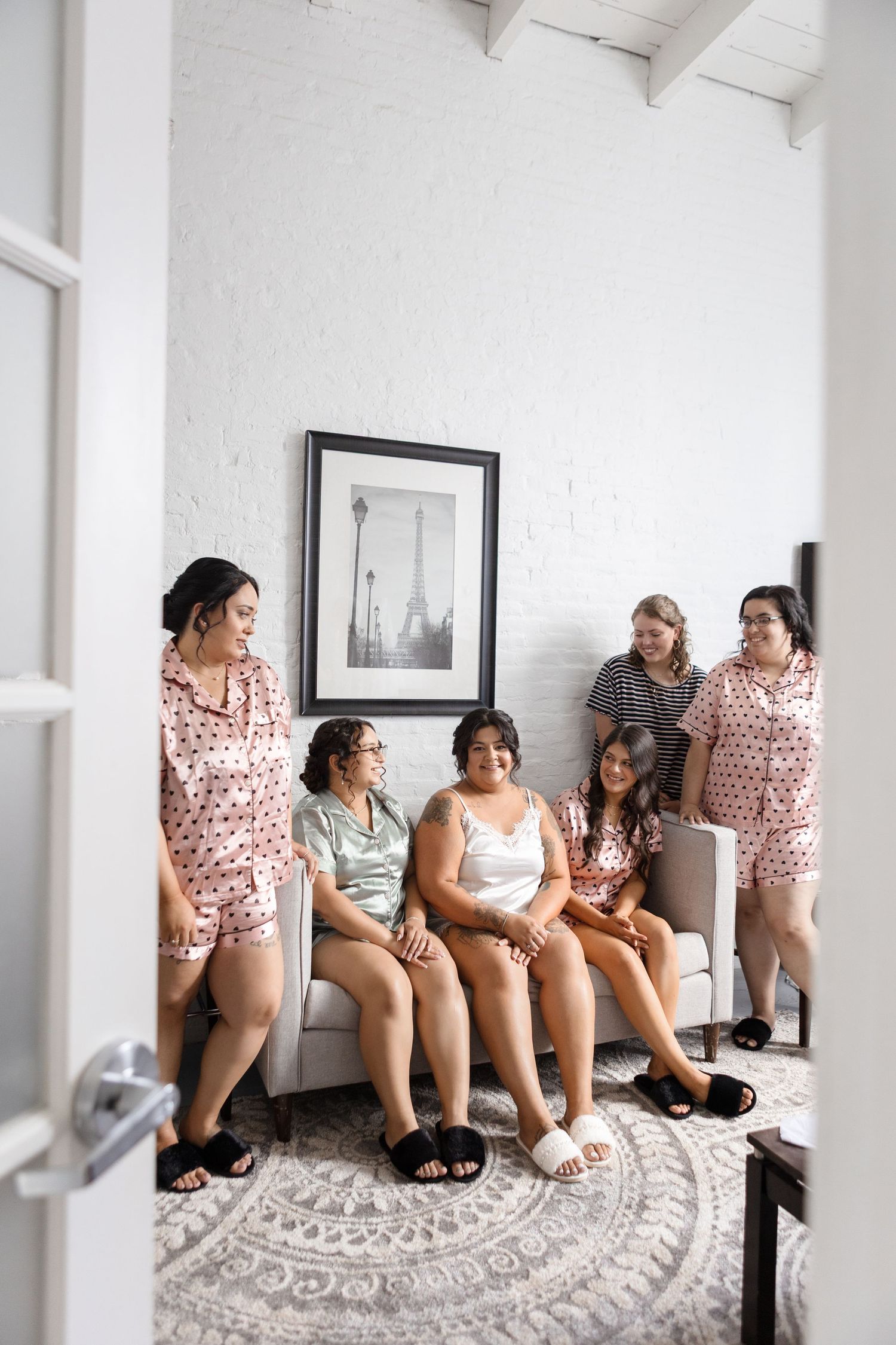 Bride and bridesmaids in white getting-ready suite at NOVA 535 in St. Petersburg, Florida, captured by Grand Photo by Karyna Oliinyk.