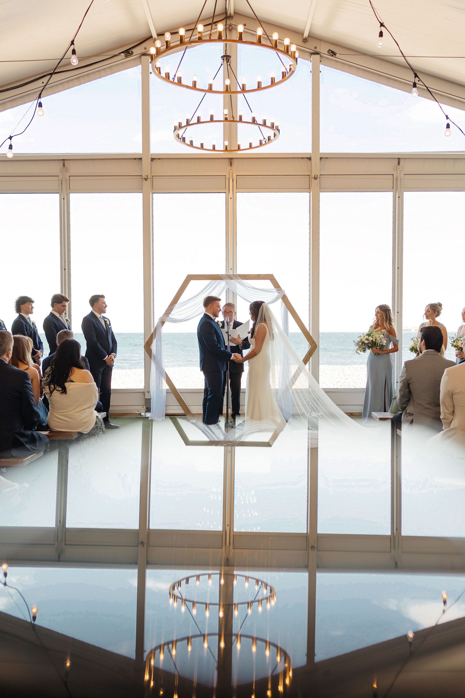 Elegant beachfront wedding ceremony at Oceanview of Nahant in Nahant, Massachusetts, captured by Grand Photo, Karyna Oliinyk
