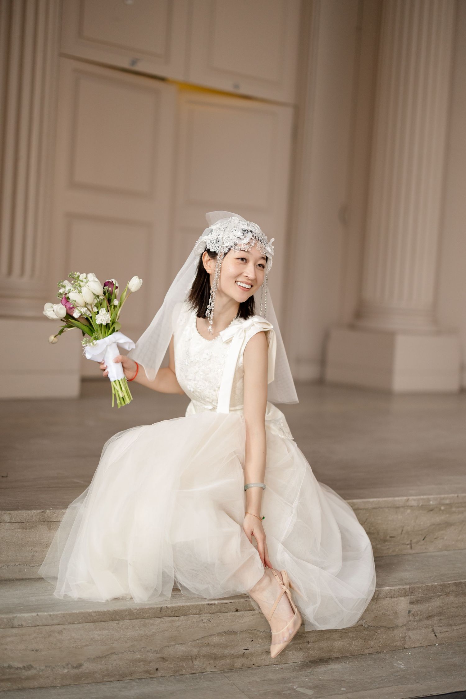 Smiling Asian bride before ceremony at Newton City Hall in Newton, Massachusetts, captured by Grand Photo by Karyna Oliinyk