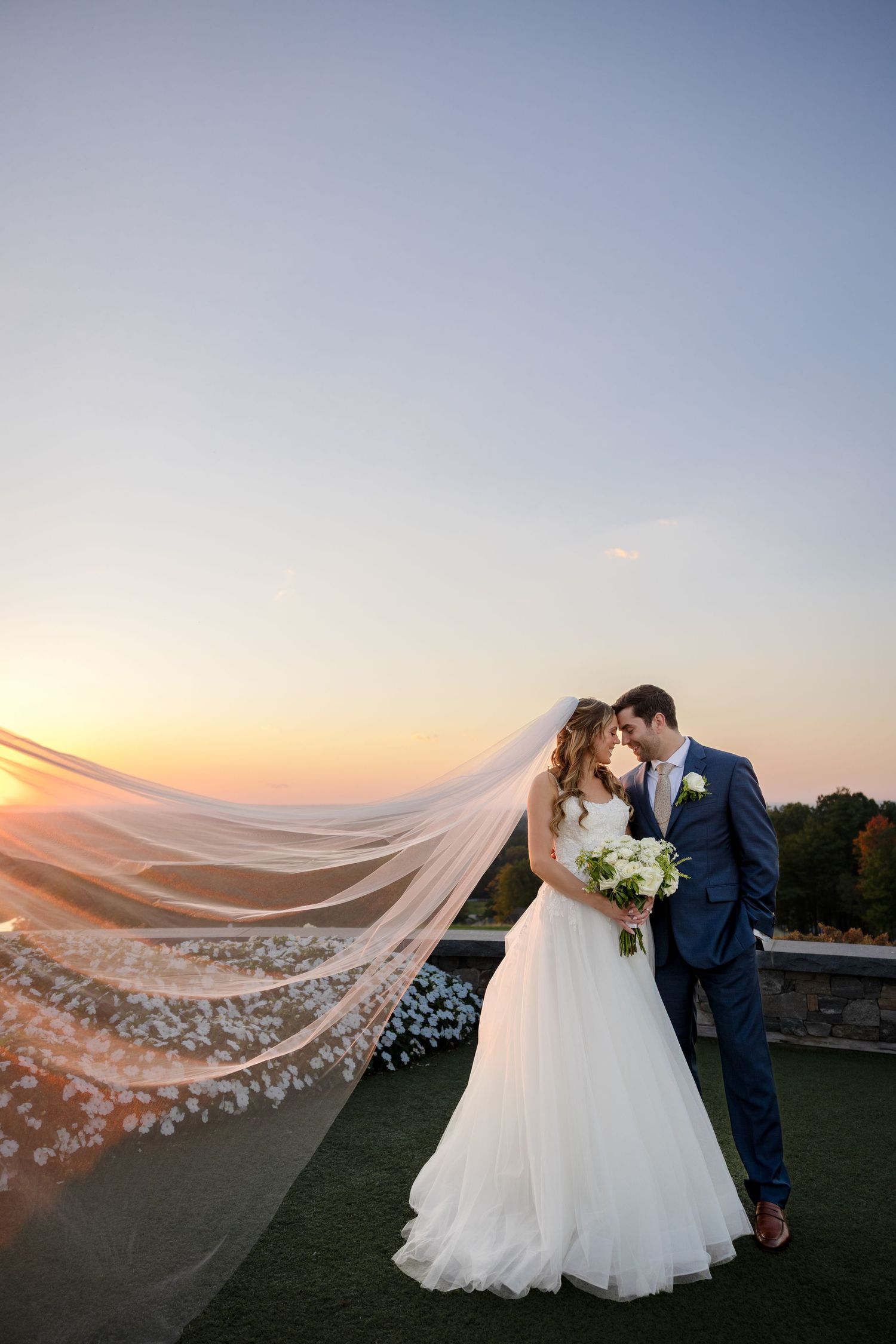 Bride and groom first kiss with lace-trimmed details at The Great Horse in Hampden, Massachusetts, captured by Grand Photo by Karyna Oliinyk