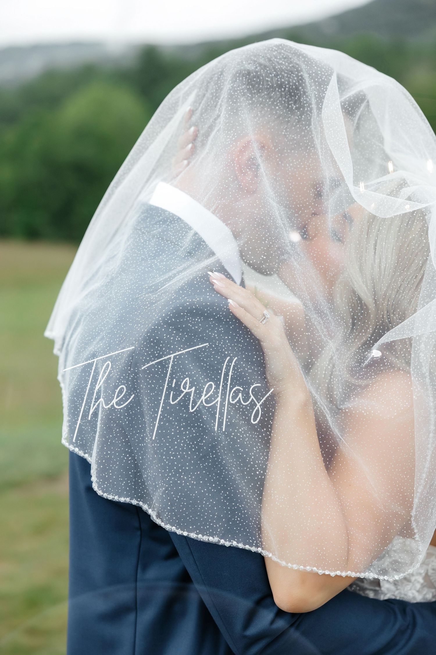 Bride and groom under a pearl-trimmed veil at Marie Selby Botanical Gardens in Sarasota, Florida, captured by Grand Photo by Karyna Oliinyk