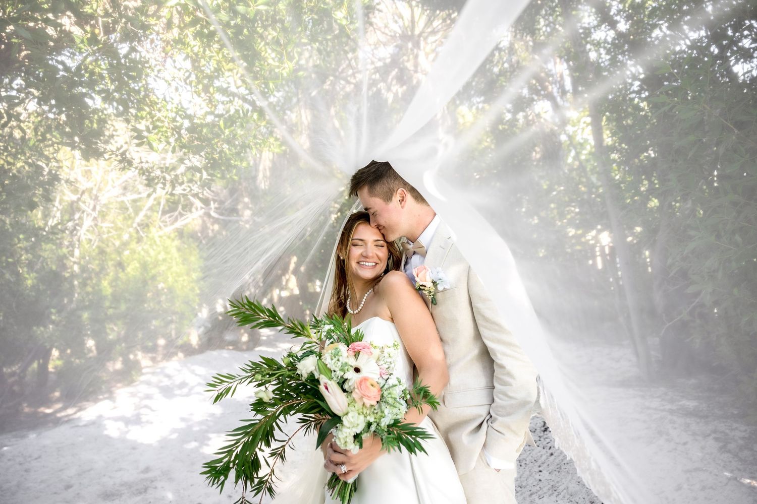 Wedding couple at Marie Selby Botanical Gardens in Sarasota Florida, captured by Grand Photo by Karyna Oliinyk