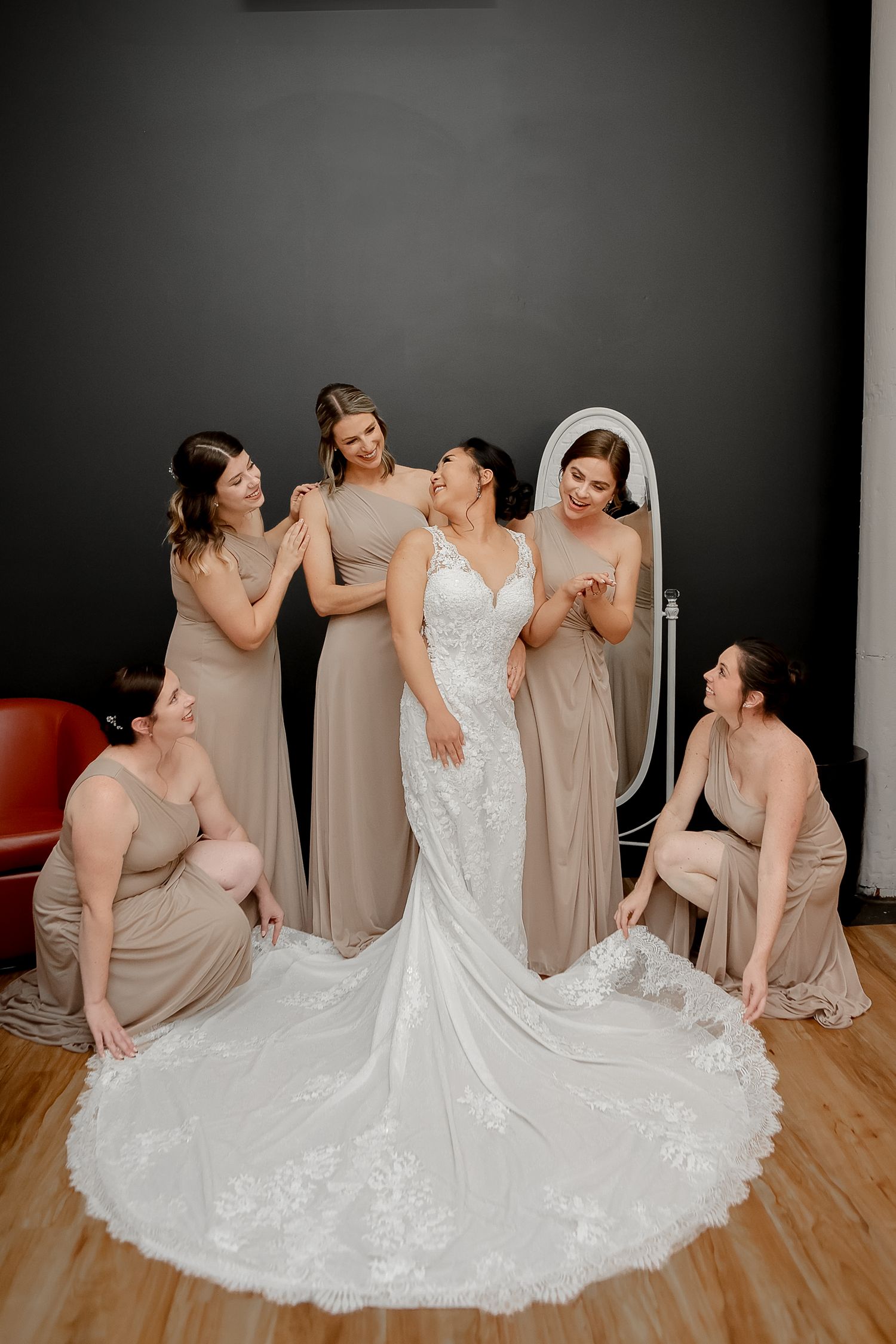 Bridesmaids help bride get ready before ceremony at NOVA 535 in St. Petersburg, Florida, captured by Grand Photo by Karyna Oliinyk