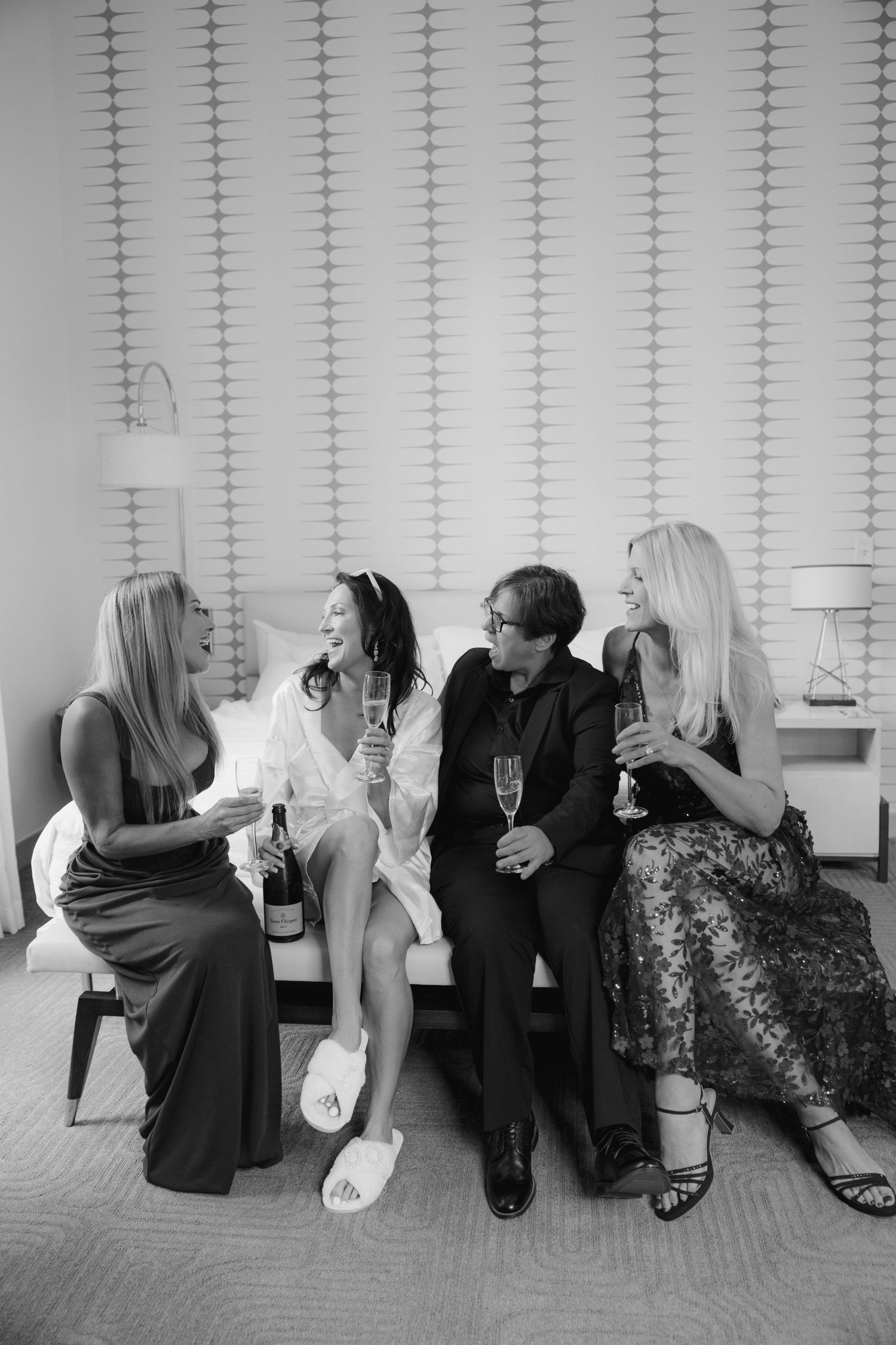 Bride with bridesmaids toasting champagne before wedding ceremony at Le Méridien Tampa, Florida, captured by Grand Photo by Karyna Oliinyk