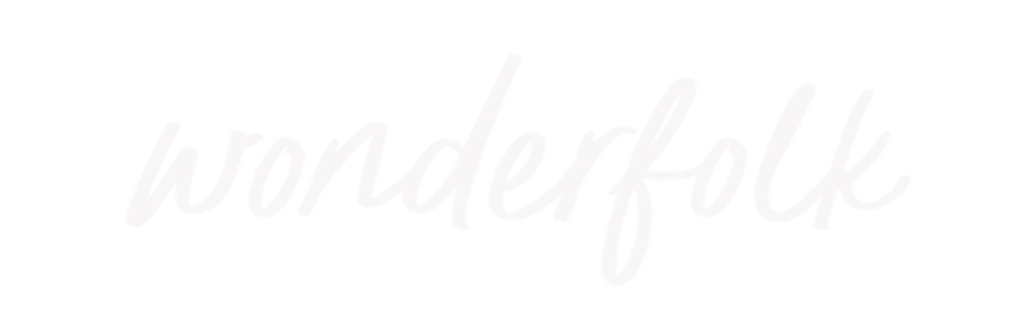 Wonderfolk elegant cursive logo in light gray script on a white background.