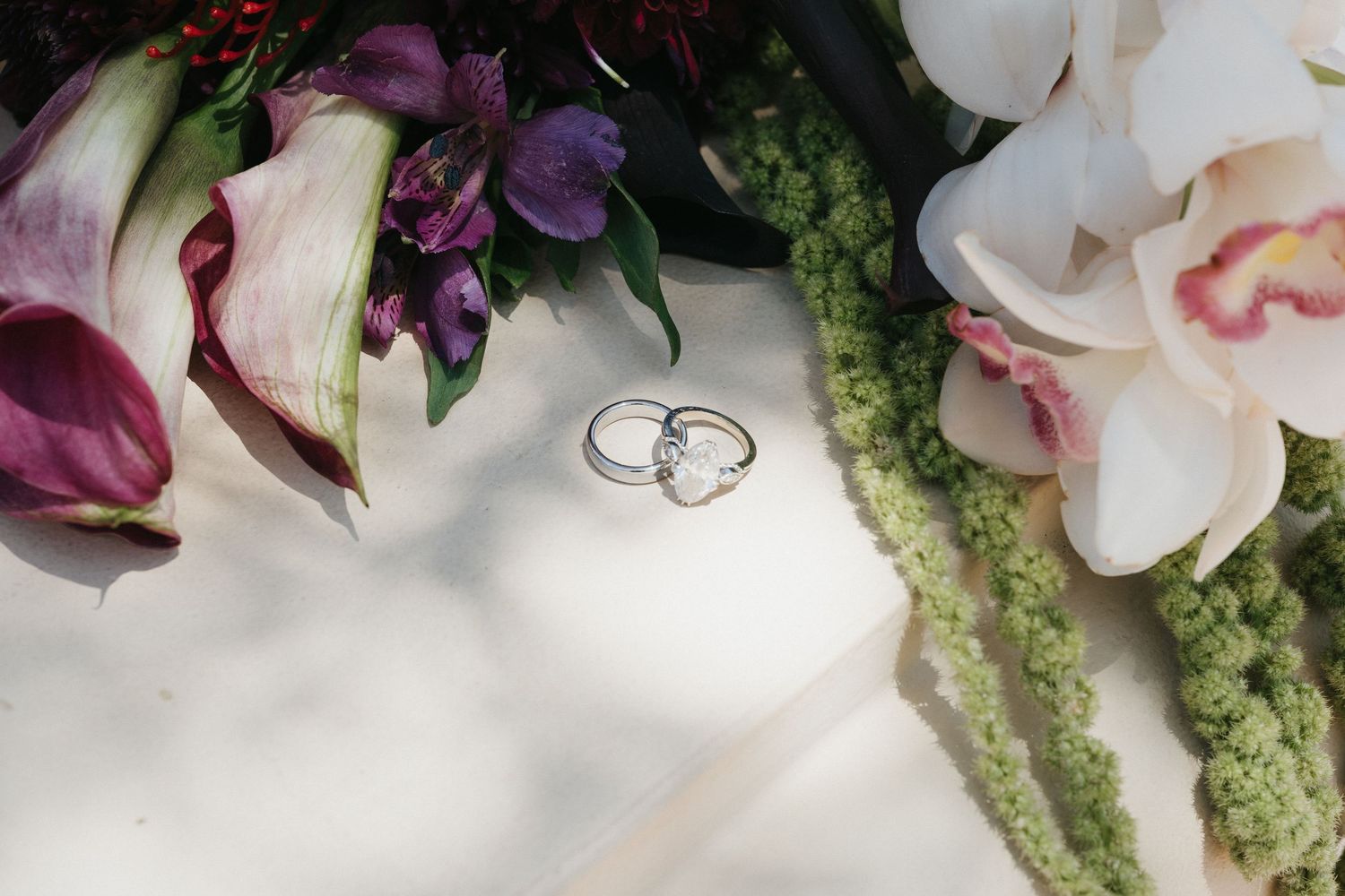 Detail Image of wedding rings and bridal bouquet.