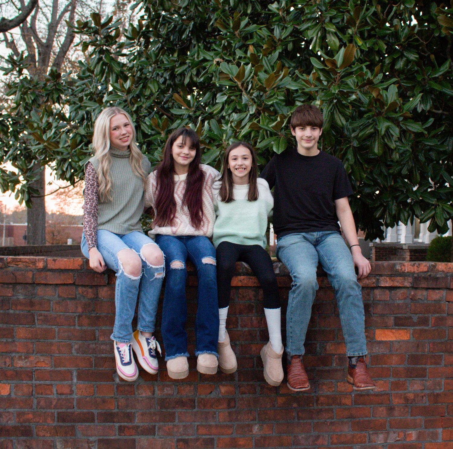 Siblings smiling for a portrait style photo.