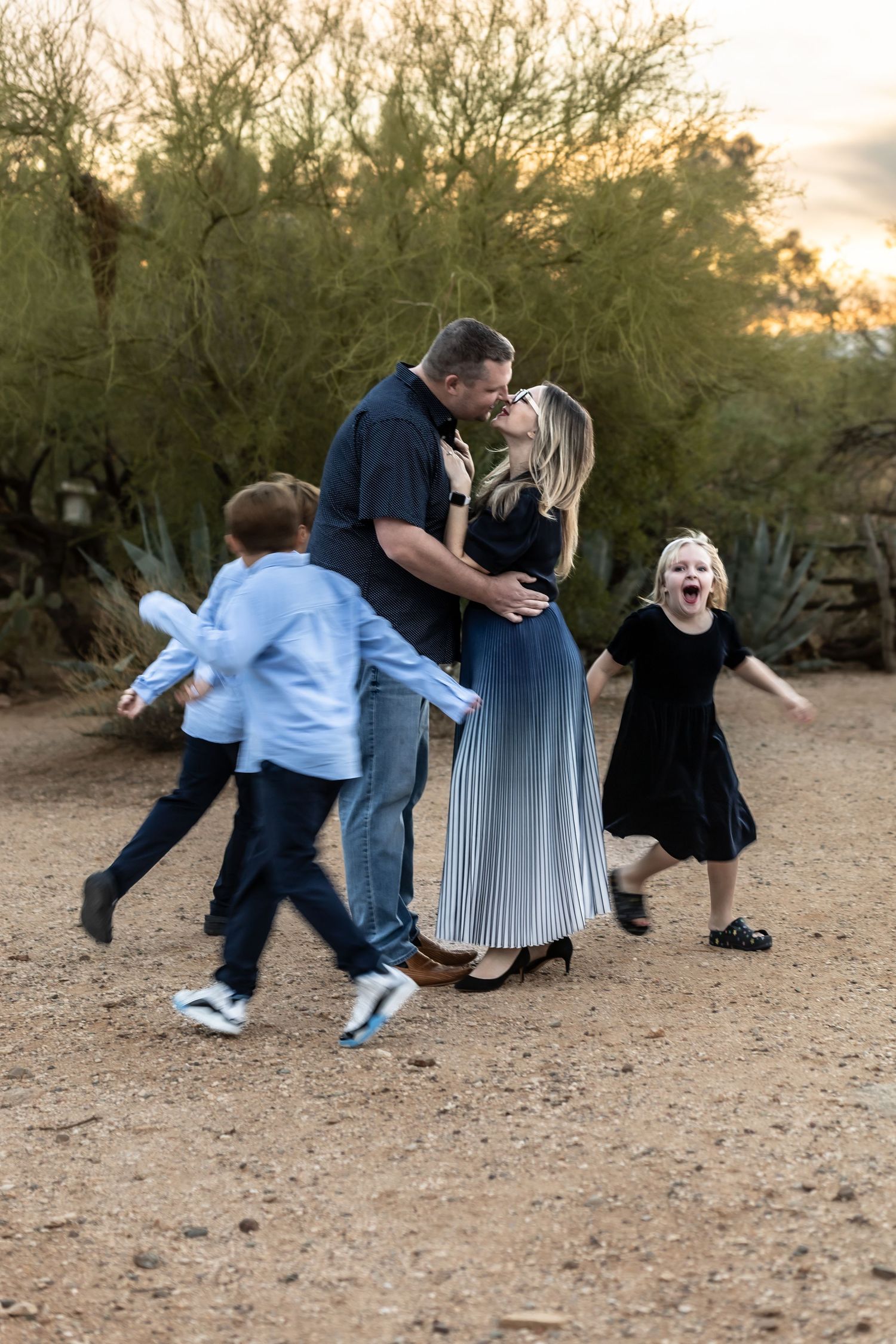 Family photography session in Tucson Arizona desert capturing candid connection and love designed for printed wall art