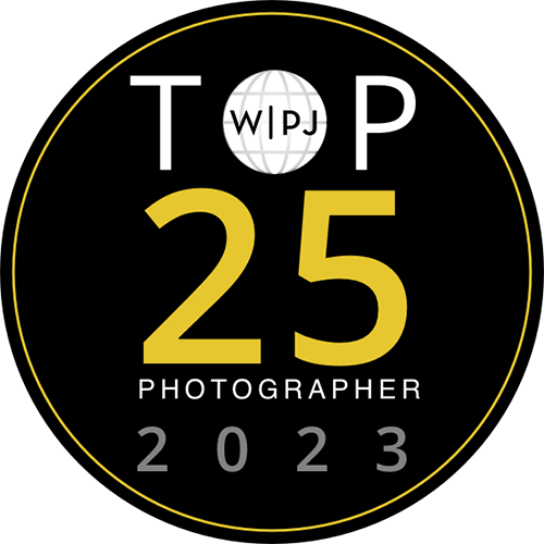 Official gold badge recognizing Nilufer Nalbantoglu as a Top 25 Wedding Photojournalist in the World for 2023 by the WPJA.