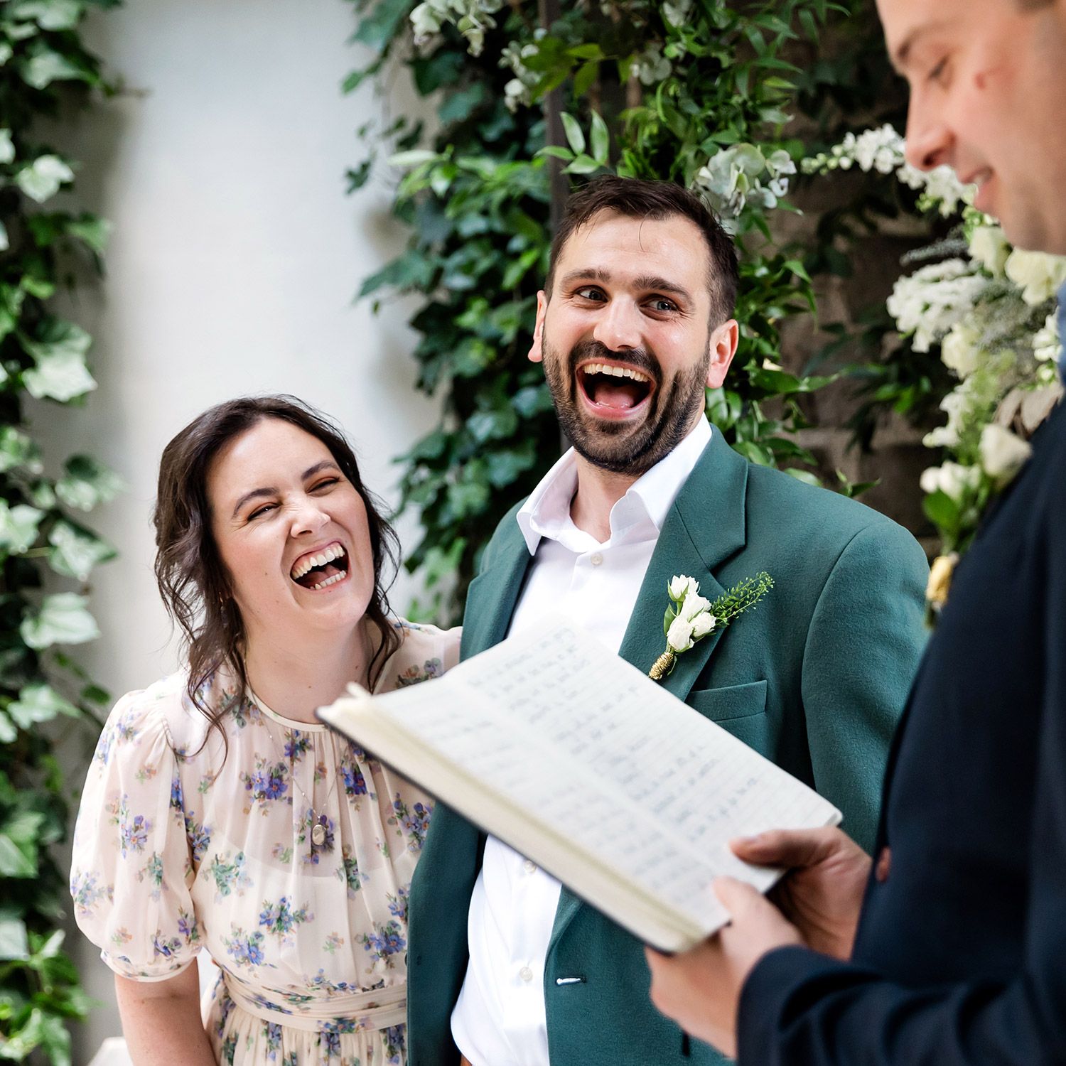 A bride and groom laugh out loud during their intimate British wedding ceremony at Aslı Tunca in Istanbul.
