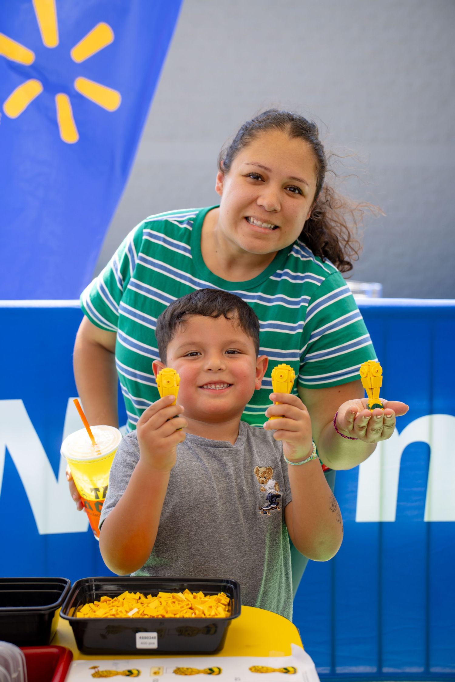 Mother and son proudly display World Cup LEGO creations at a Walmart LEGO Editions event in Rockwall Texas.