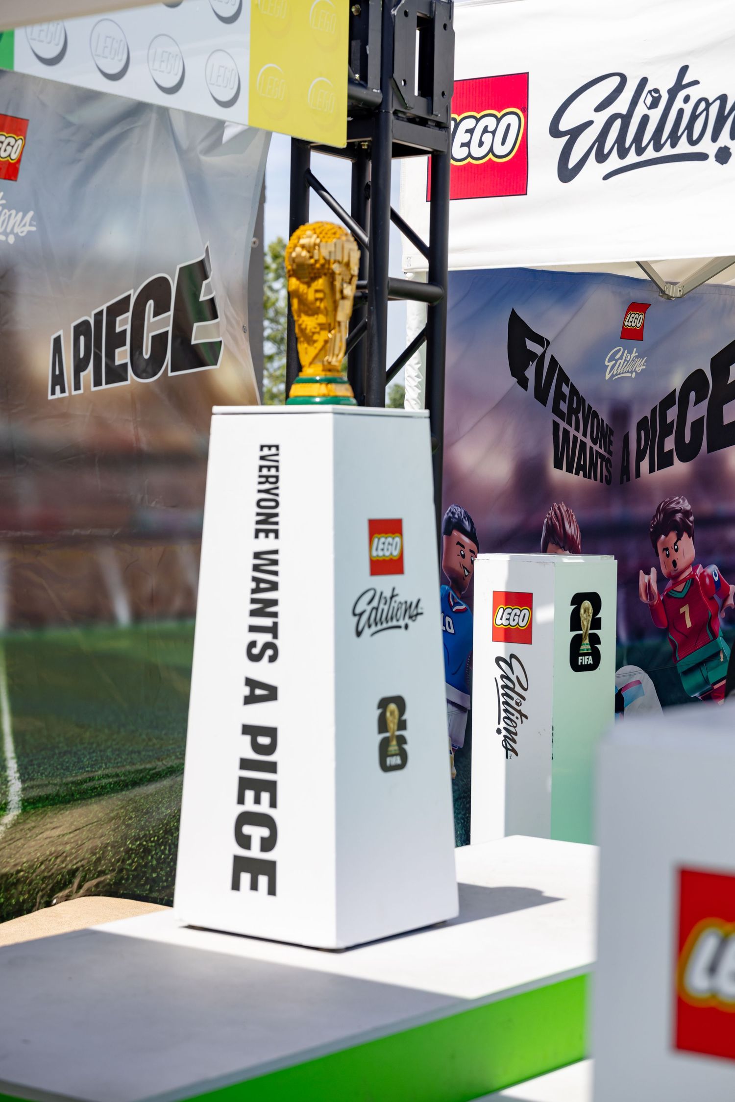 LEGO Editions display featuring FIFA World Cup trophy with Everyone Wants A Piece signage.