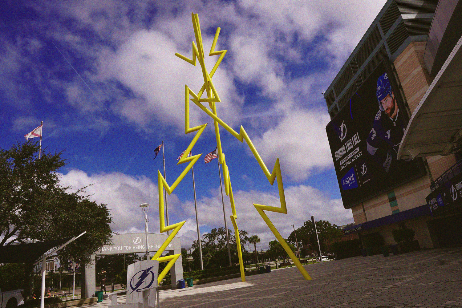 A large yellow lightning bolt sculpture outside Amalie Arena, home of the Tampa Bay Lightning NHL team.