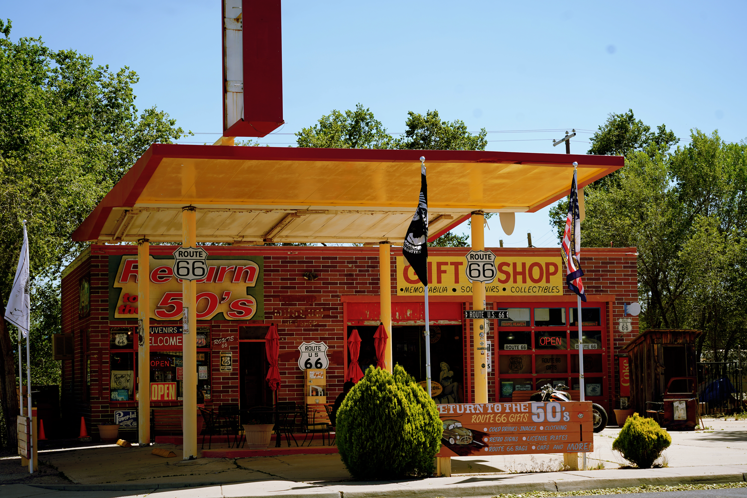 Colorful Route 66 gift shop with bright red and yellow facade on historic highway.