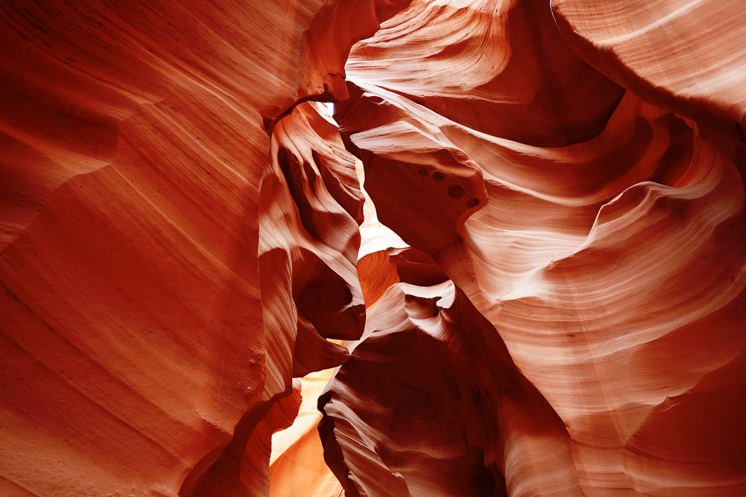 Stunning red sandstone formations inside Antelope Canyon, Arizona, with smooth flowing walls and natural light.