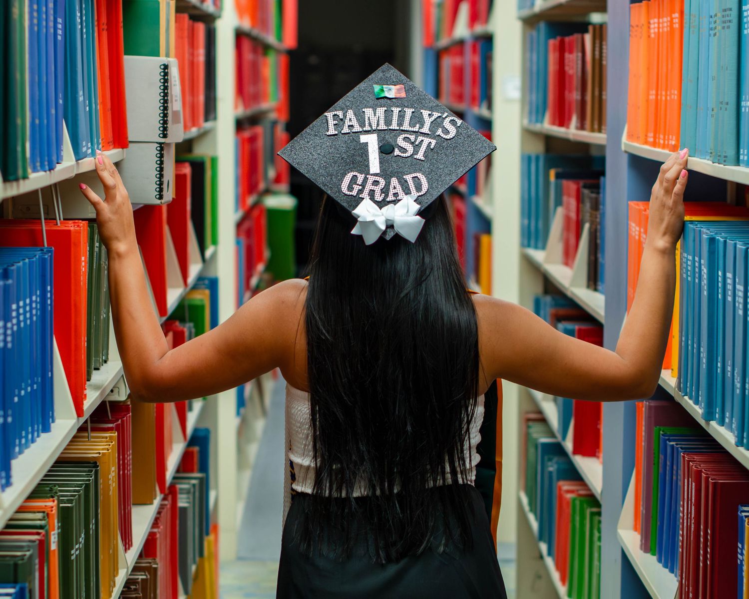Senior graduation portrait in library — decorated cap, Bay Area senior portrait photographer