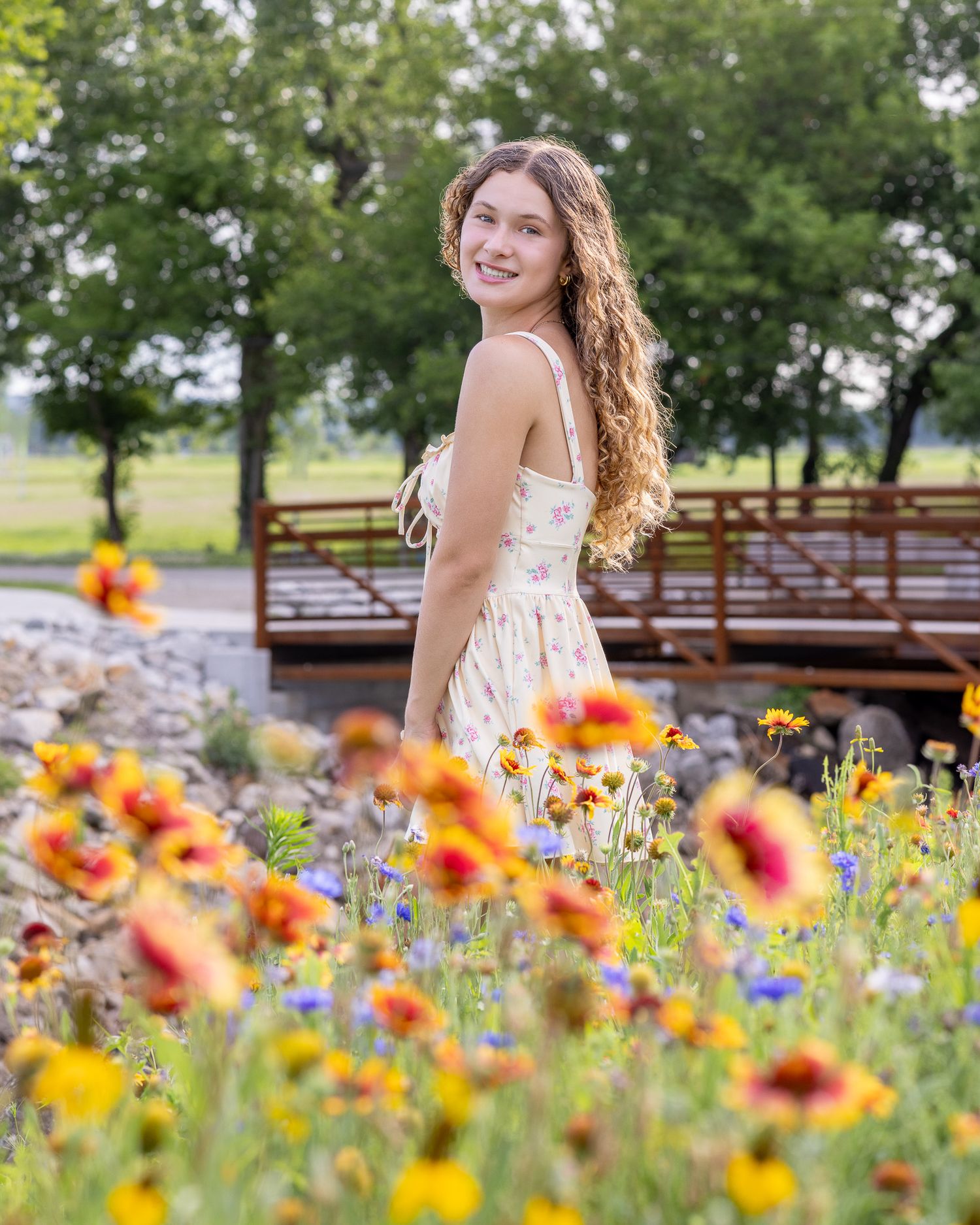 Senior portrait photo of a young lady among the flowers at English Landing Park in Parkville | Kansas City Northland Portrait Photographer
