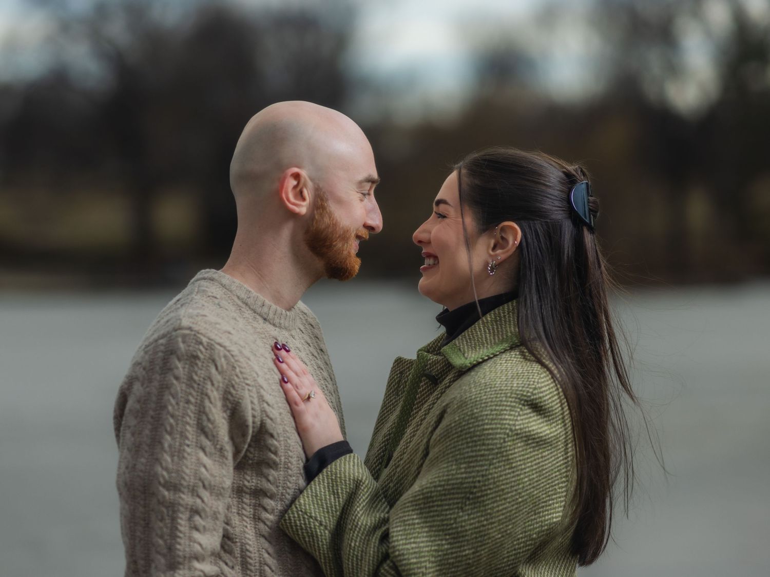 Photo of a couple smiling at each other during engagement session at Loose Park Kansas City | Kansas City Northland Portrait Photographer
