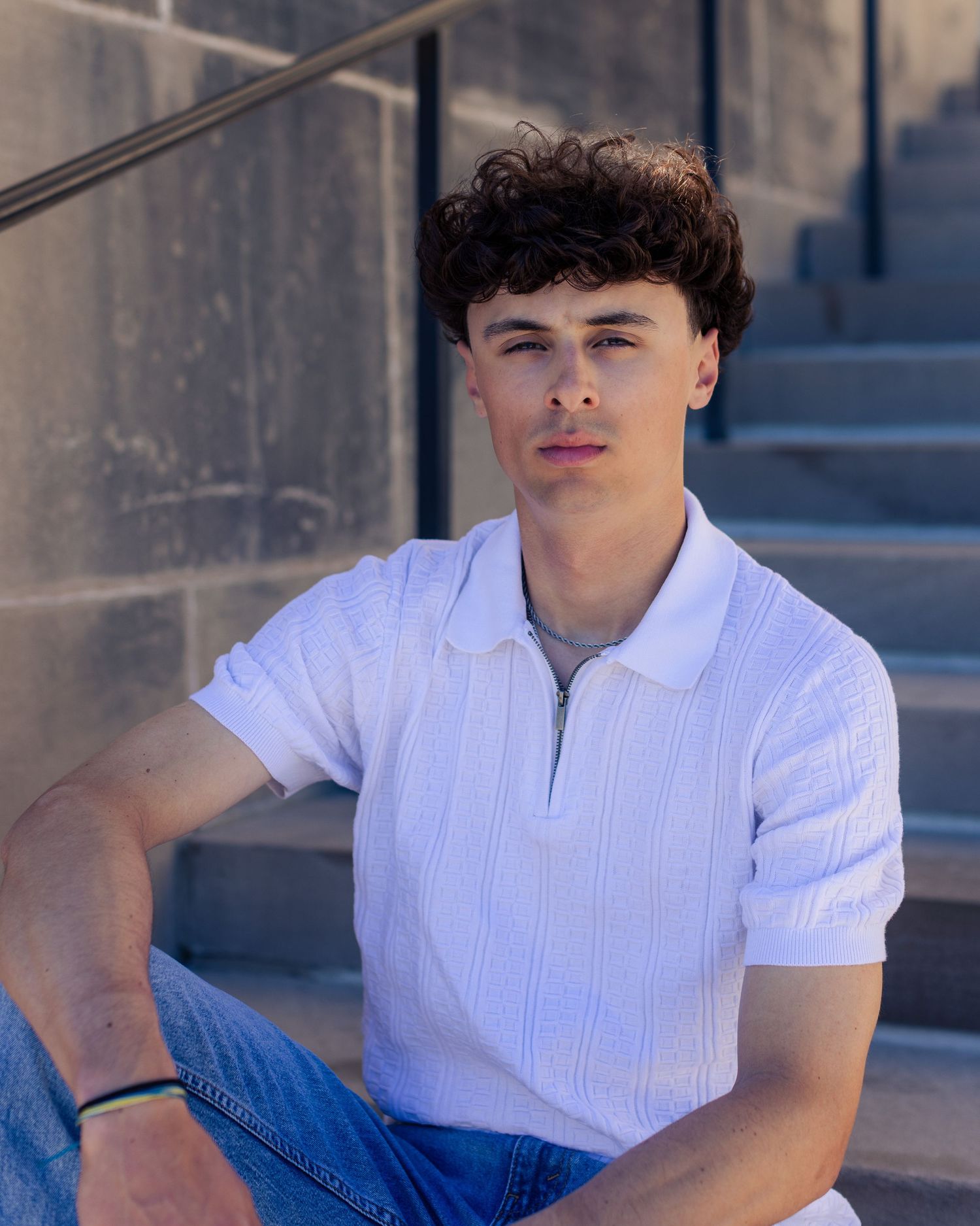 Senior portrait photo of a young man on the steps of Nelson-Atkins Museum in KC | Kansas City Northland Portrait Photographer
