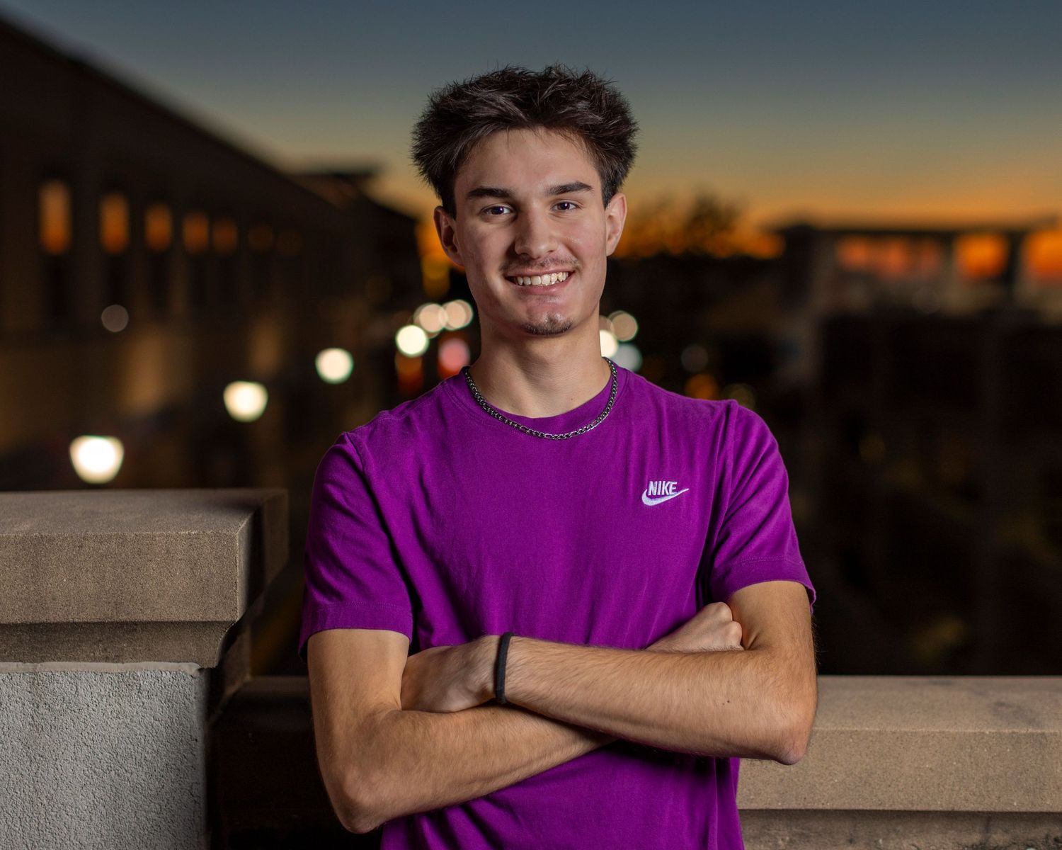 Senior portrait photo of a young against a colorful sunset at Zona Rosa in the KC Northland | Kansas City Northland Portrait Photographer